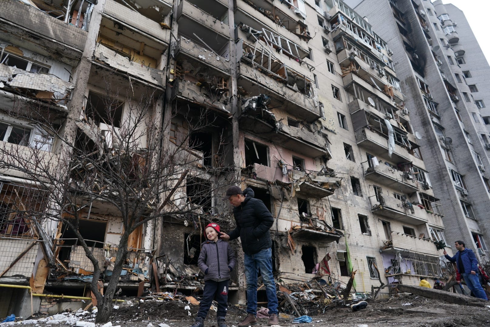 KYIV, UKRAINE - FEBRUARY 25: Civilians are seen after a missile struck a residential building during Russiaâs military intervention in left bank Kyiv, Ukraine on February 25, 2022 (Photo by Wolfgang Schwan/Anadolu Agency via Getty Images)