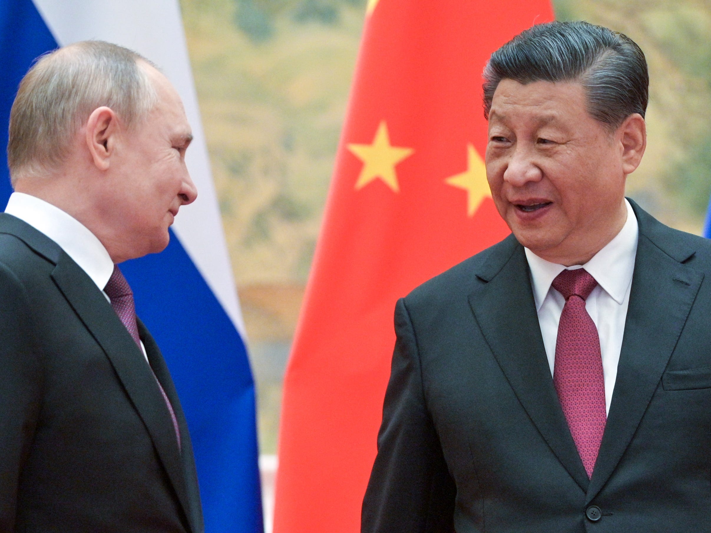 Russia's President Vladimir Putin (L) and his Chinese counterpart Xi Jinping pose during a meeting at the Diaoyutai State Guesthouse.