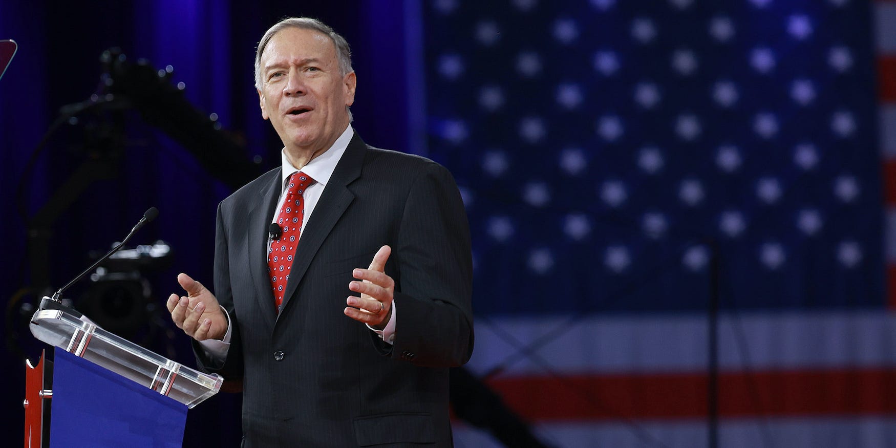 Mike Pompeo gestures off to his left side at CPAC 2022.