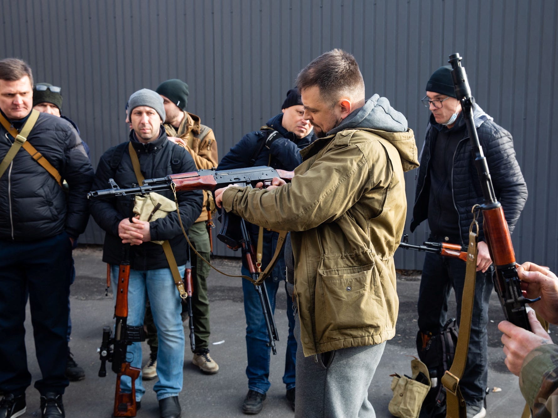 Members of the Territorial Defence Forces of Ukraine receive weapons to defend the city of Kyiv, Ukraine February 25, 2022.