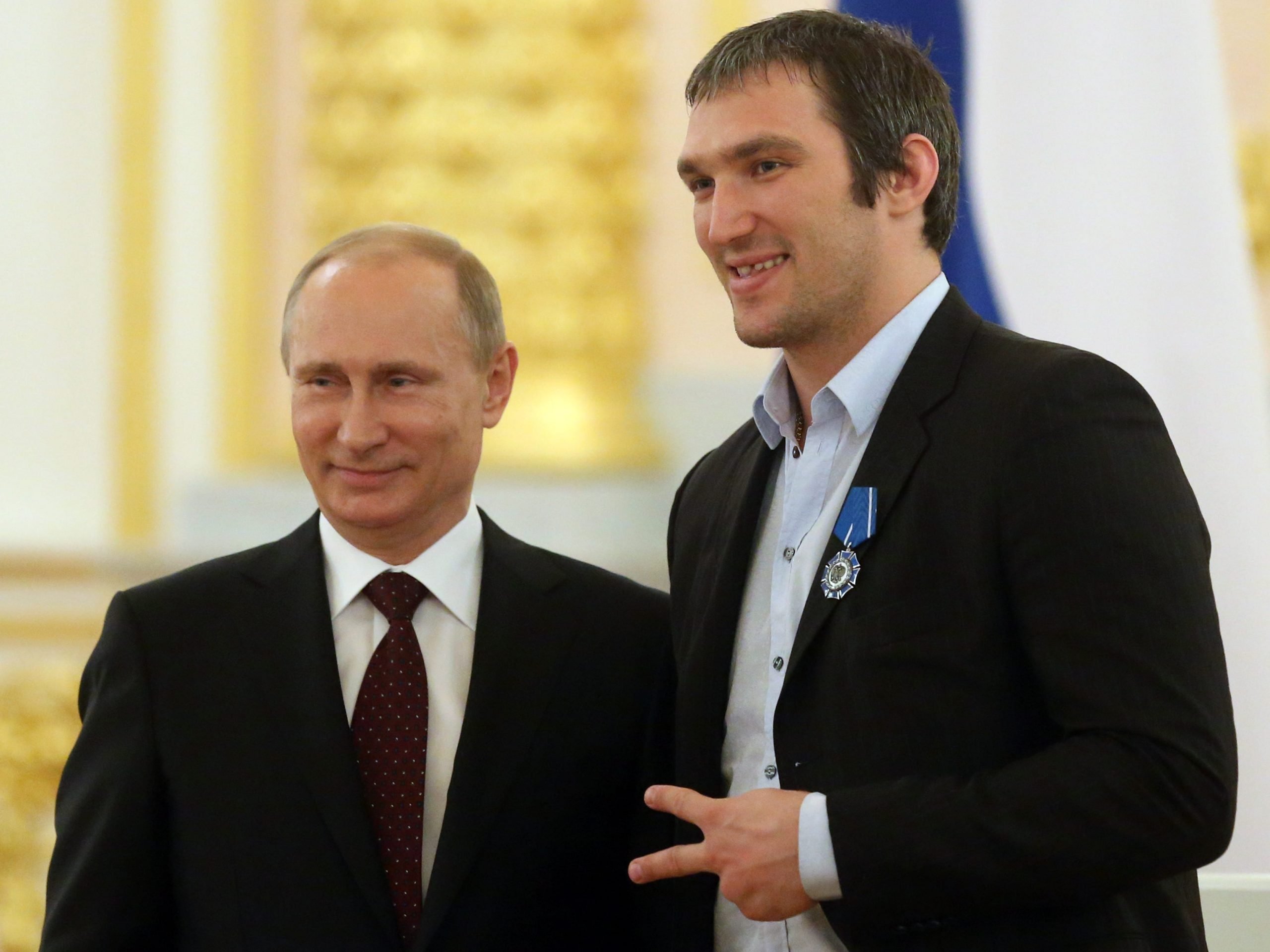 Russian President Vladimir Putin (L) and Russian-born hockey player Alex Ovechkin (R) stand together in the Kremlin on May 27, 2014, in Moscow, Russia.