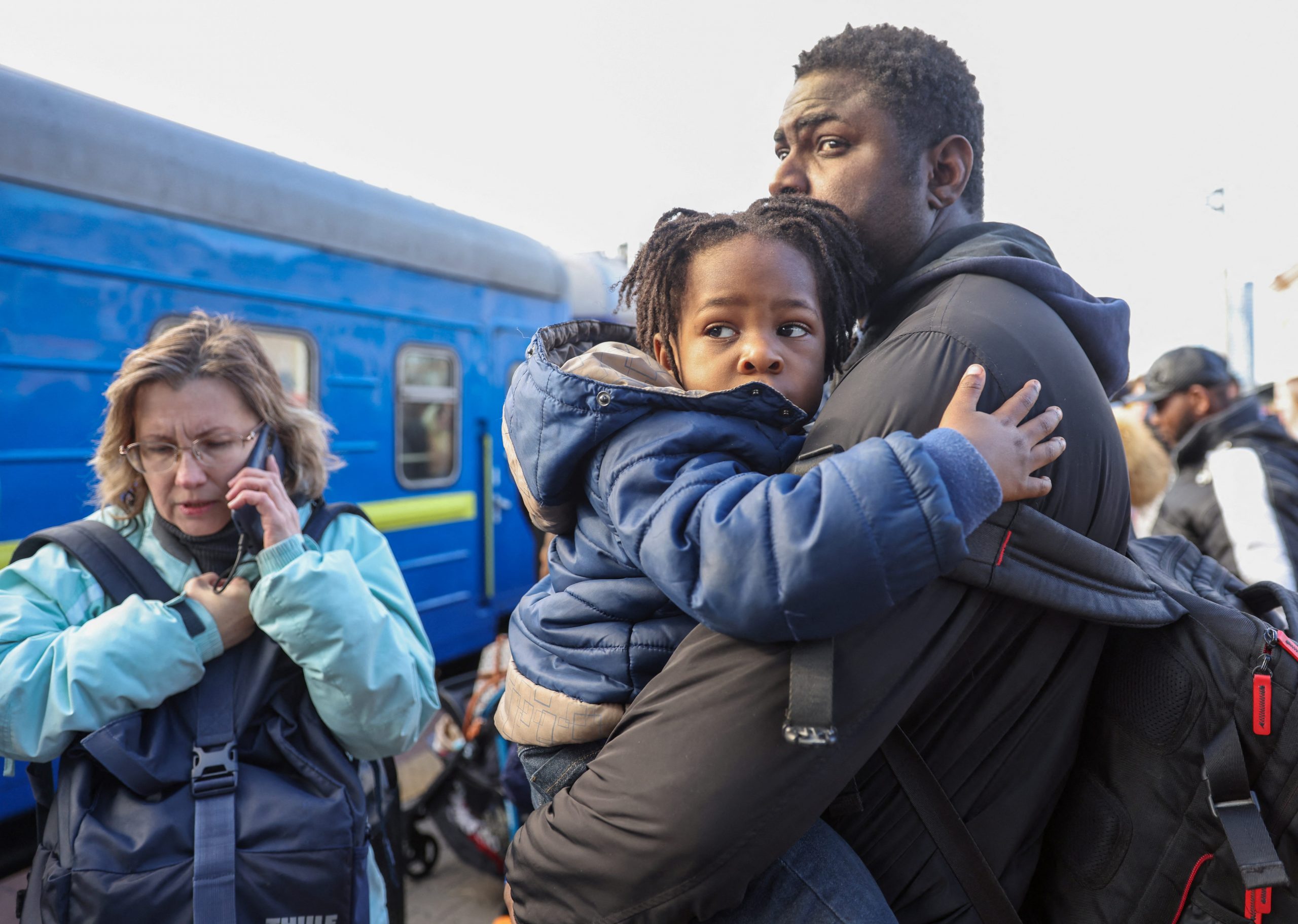 People wait to board an evacuation train from Kyiv to Lviv at Kyiv central train station, Ukraine, February 25, 2022.