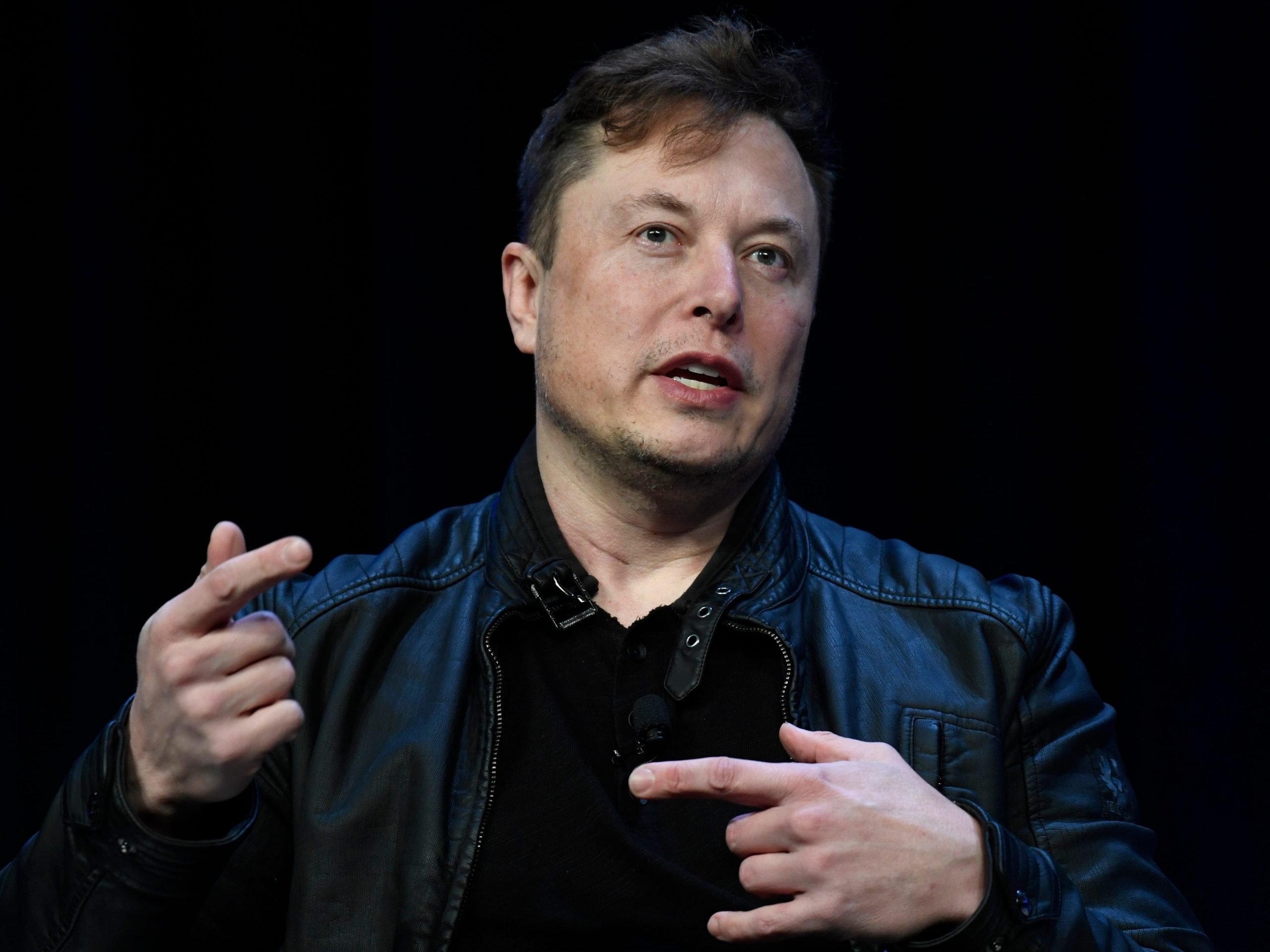 Elon Musk is captured talking at a conference.