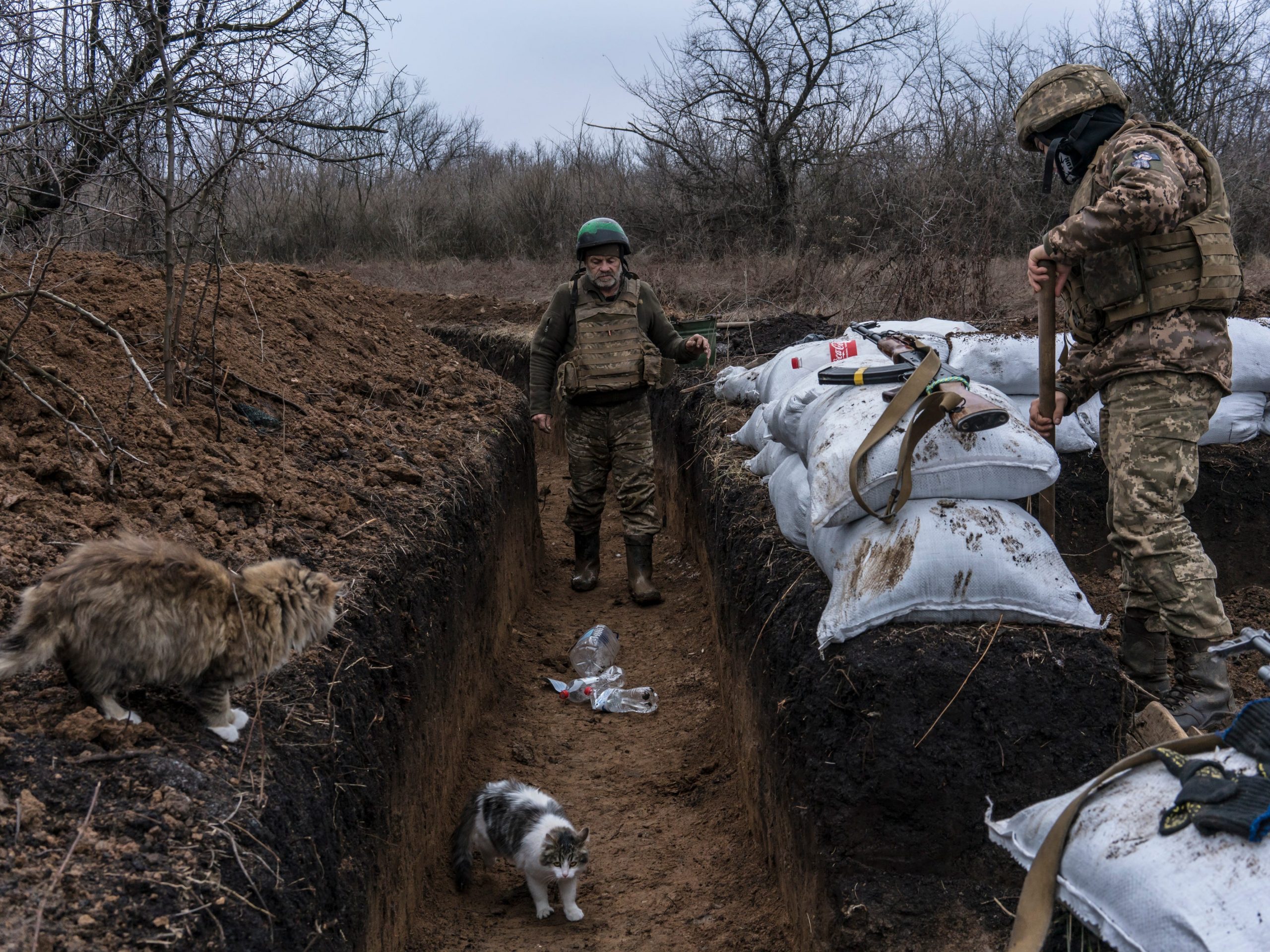 Ukrainian soldiers Mykhailo (L) and Pavlo builds a bunker on the front line on December 12, 2021 in Zolote, Ukraine.