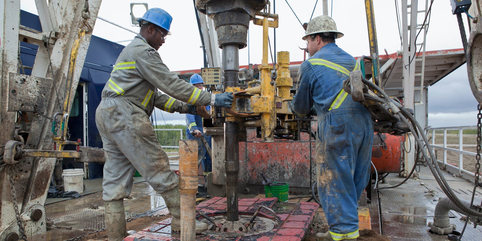 Oil workers drilling for oil on rig