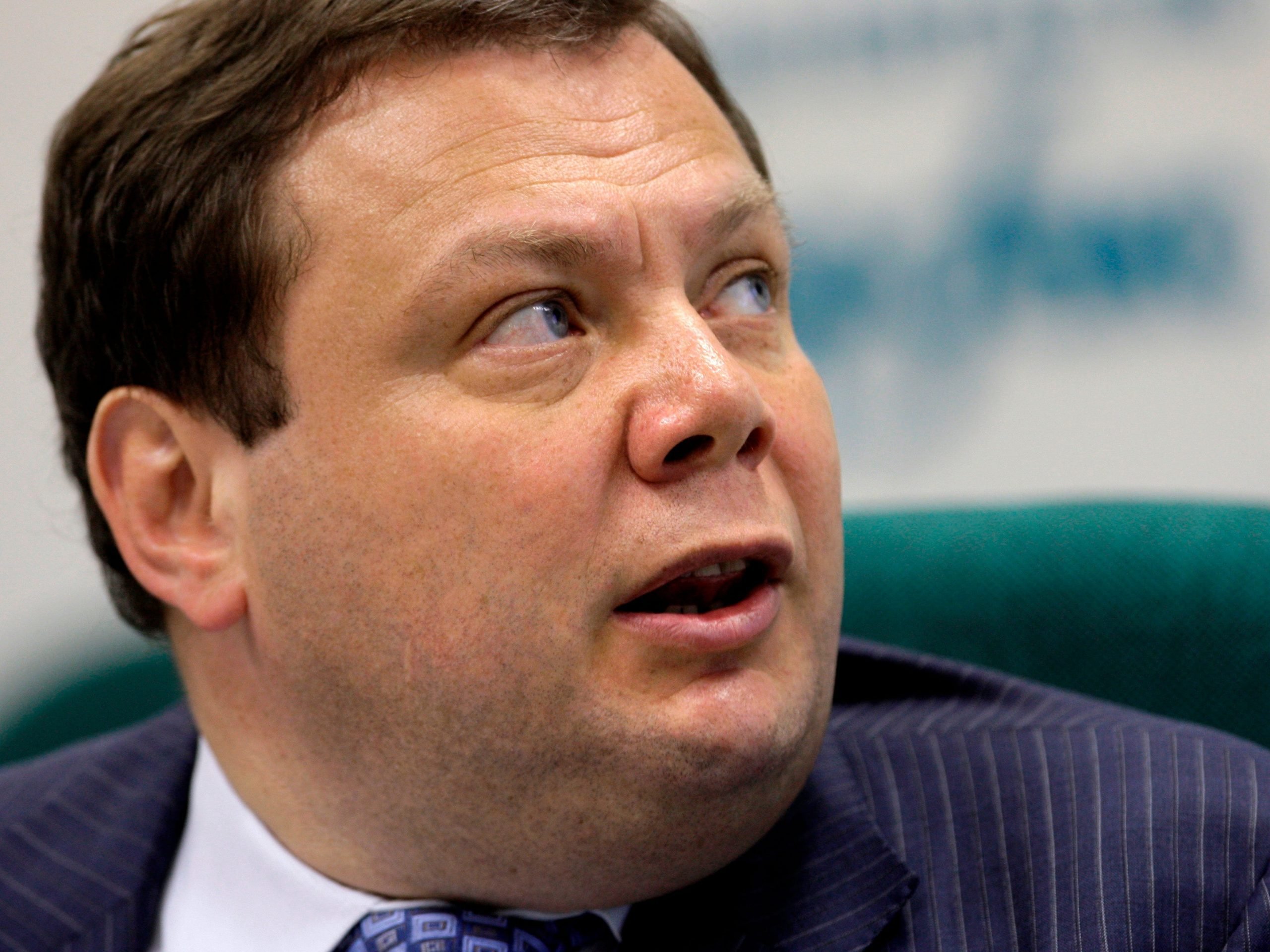 Russian billionaire Mikhail Fridman looks up and to the right.