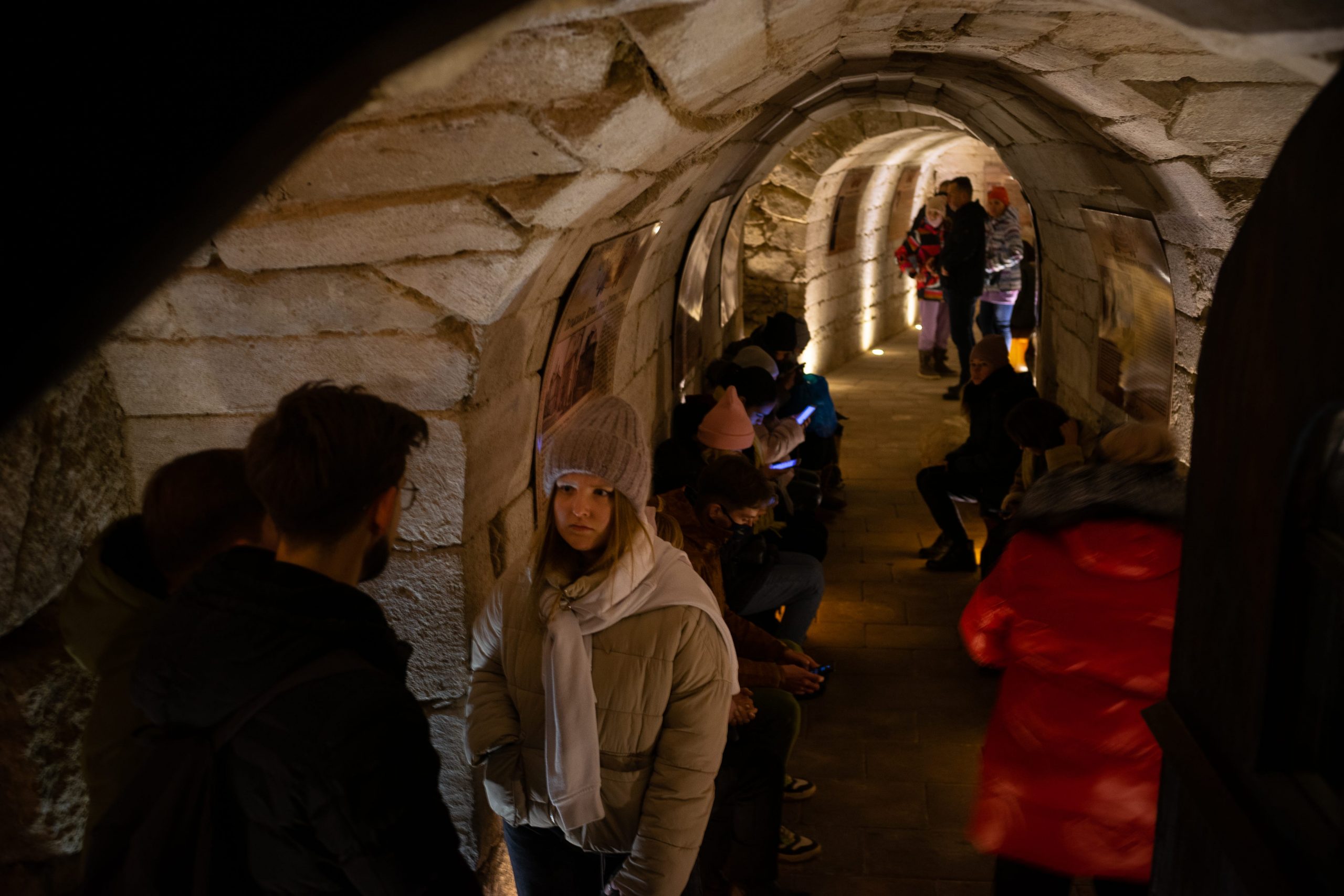 Visitors insider of the air raid shelter in the Cathedral of the Conception of the Blessed Virgin Mary