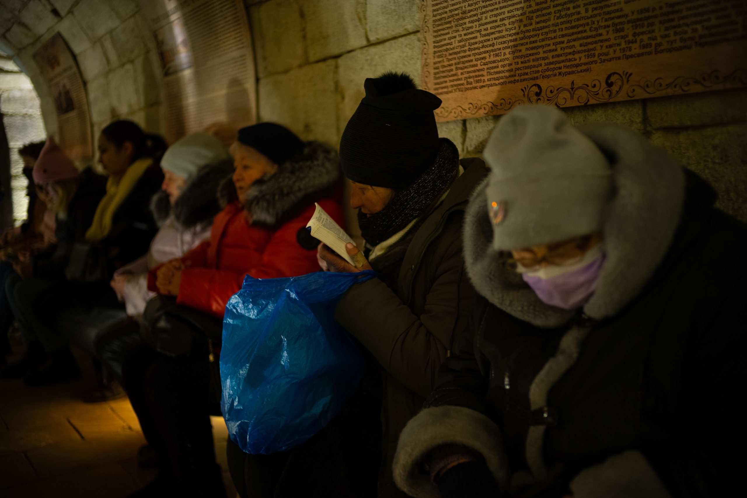 Ukrainians bundled up insider the Cathedral of the Conception of the Blessed Virgin Mary
