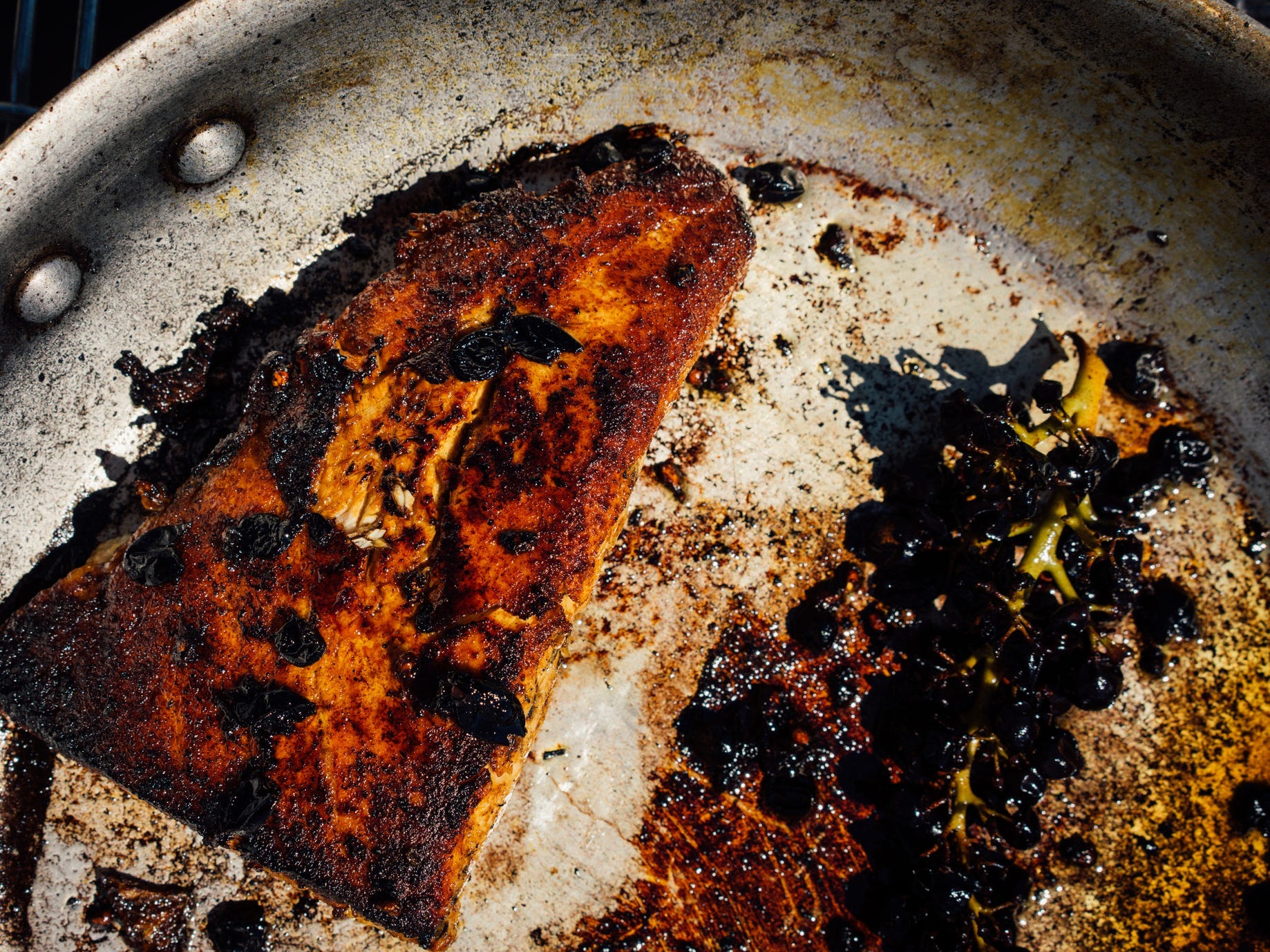 Burnt chicken or fish on a burnt pan