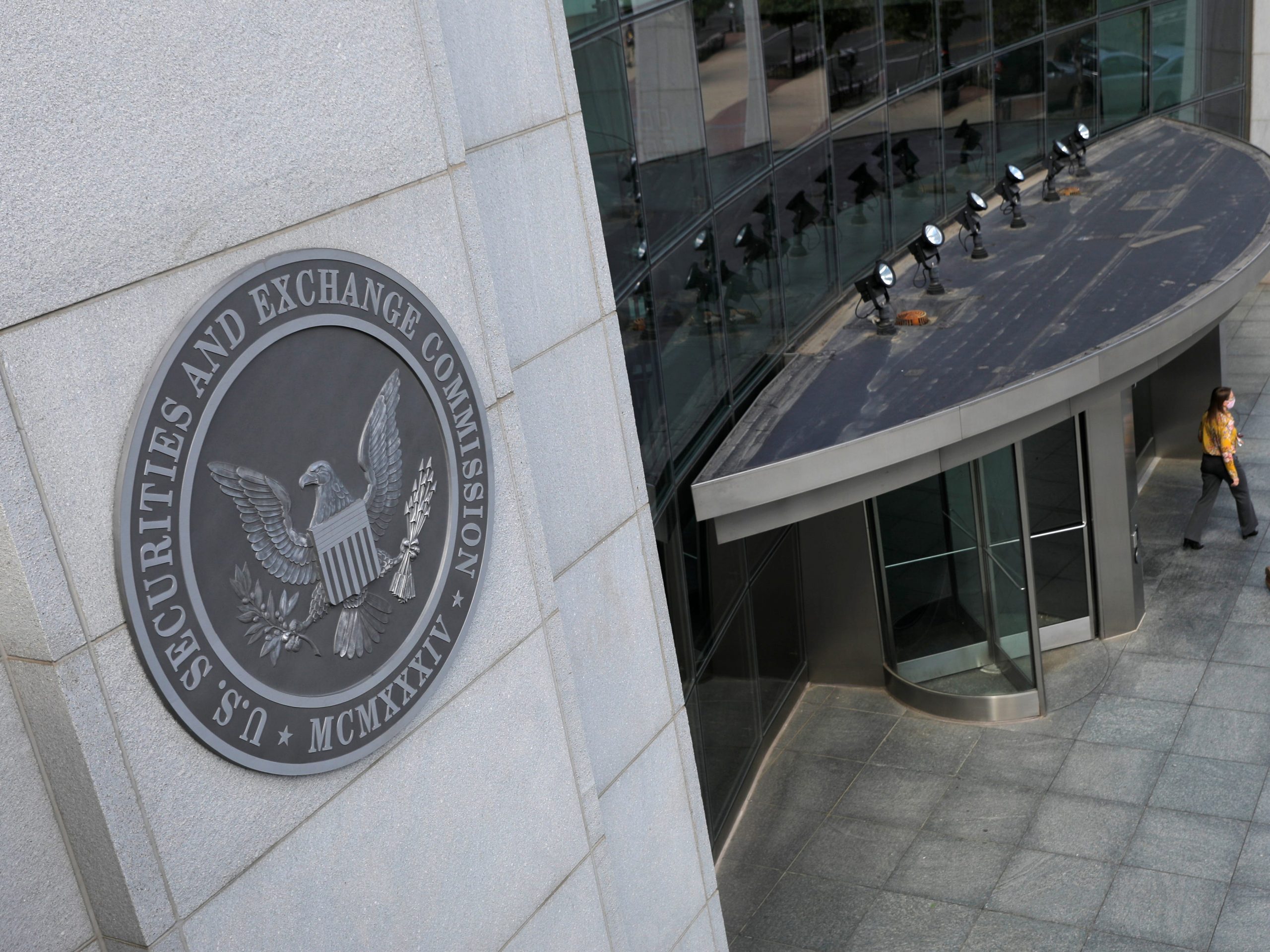 People walking out of the SEC building US Securities and Exchange Commission