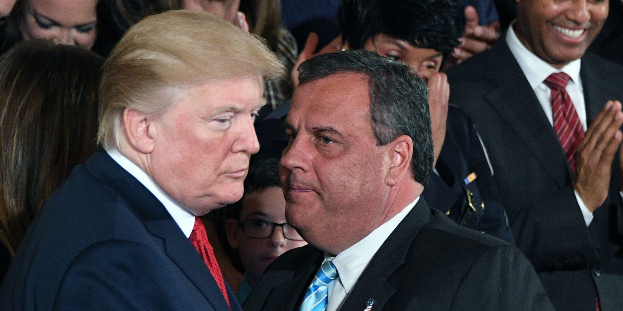 Former New Jersey Gov. Chris Christie speaks with former President Donald Trump at a White House event on October 26, 2017.