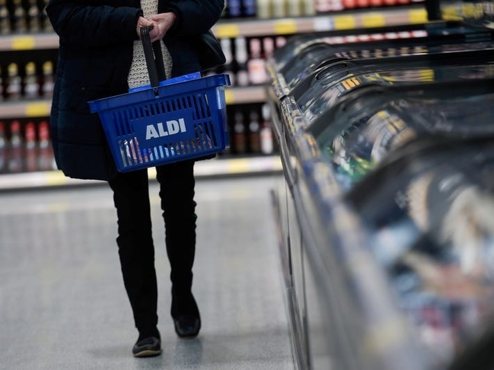 A woman carries a shopping basket in an Aldi store in London, Britain, February 15, 2018. REUTERS/Peter Summers