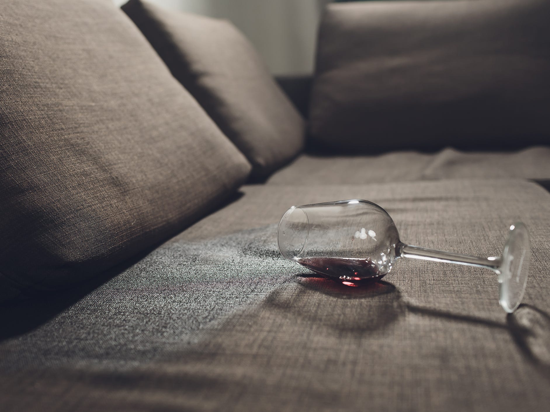 Red wine spilled on a couch