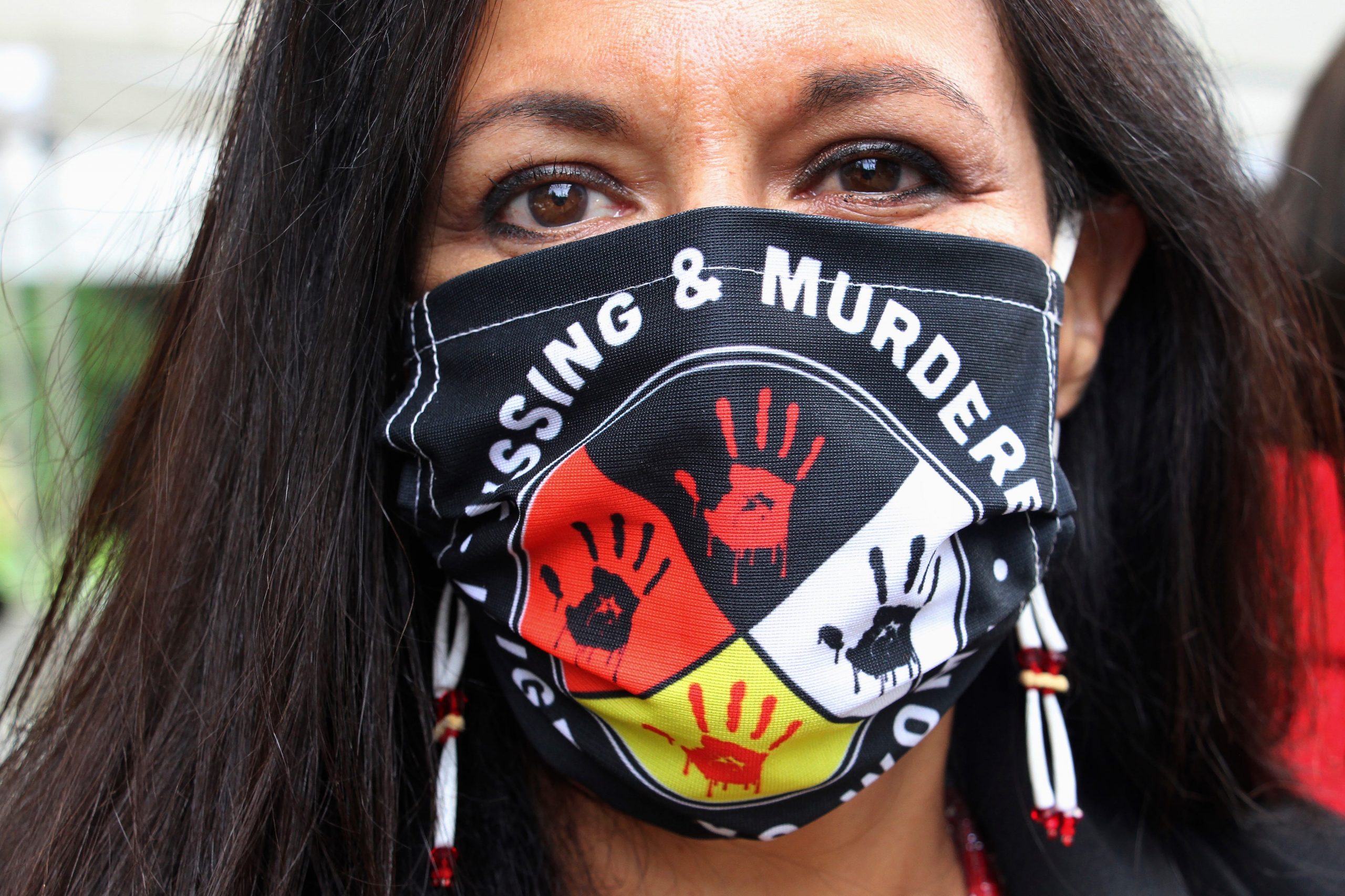 Jeannie Hovland, the deputy assistant secretary for Native American Affairs for the U.S. Department of Health and Human Services, poses with a Missing and Murdered Indigenous Women mask on Aug. 26, 2020.