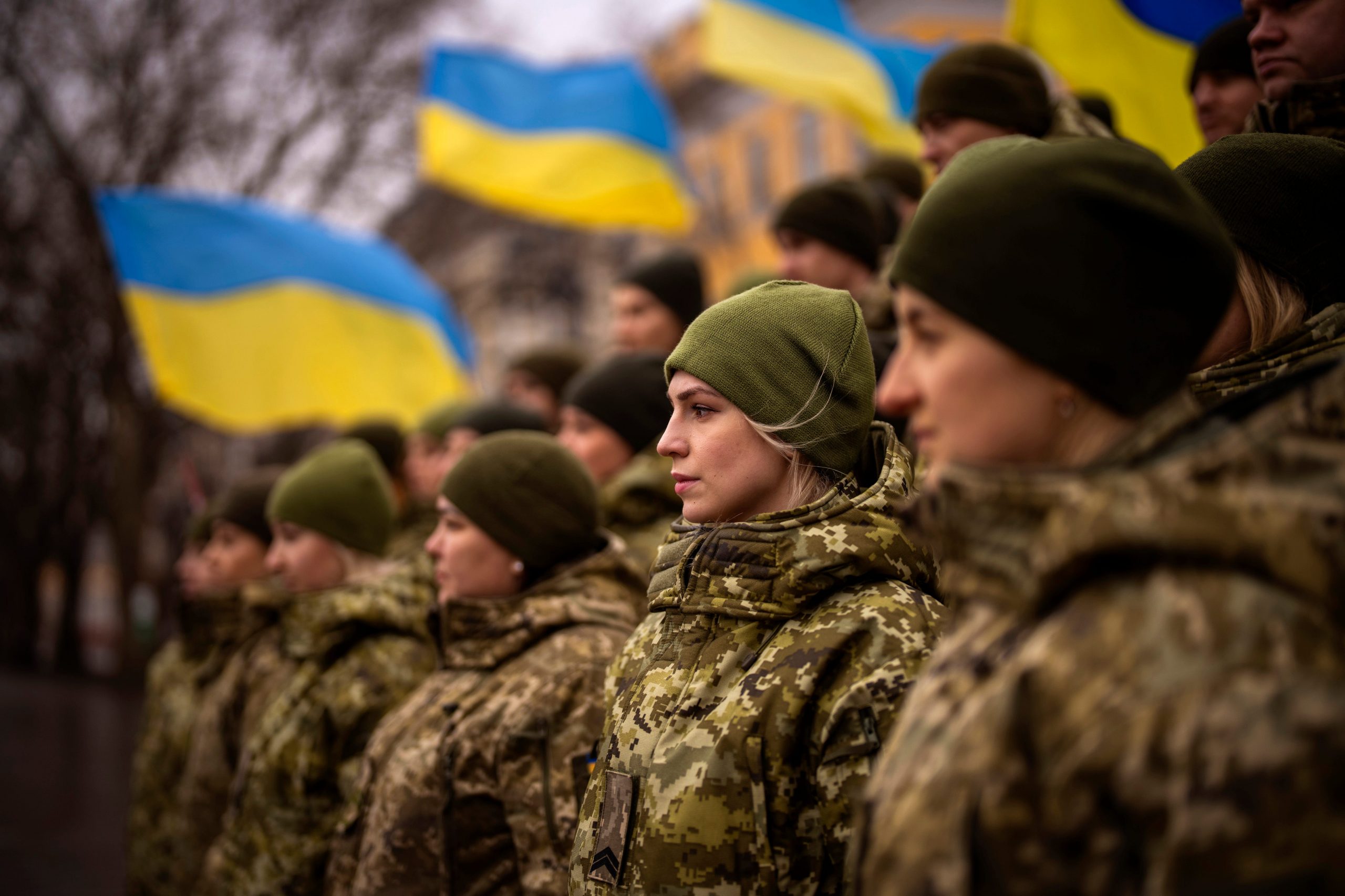 Ukrainian Army soldiers pose for a photo as they gather to celebrate a Day of Unity in Odessa, Ukraine, Wednesday, Feb. 16, 2022.