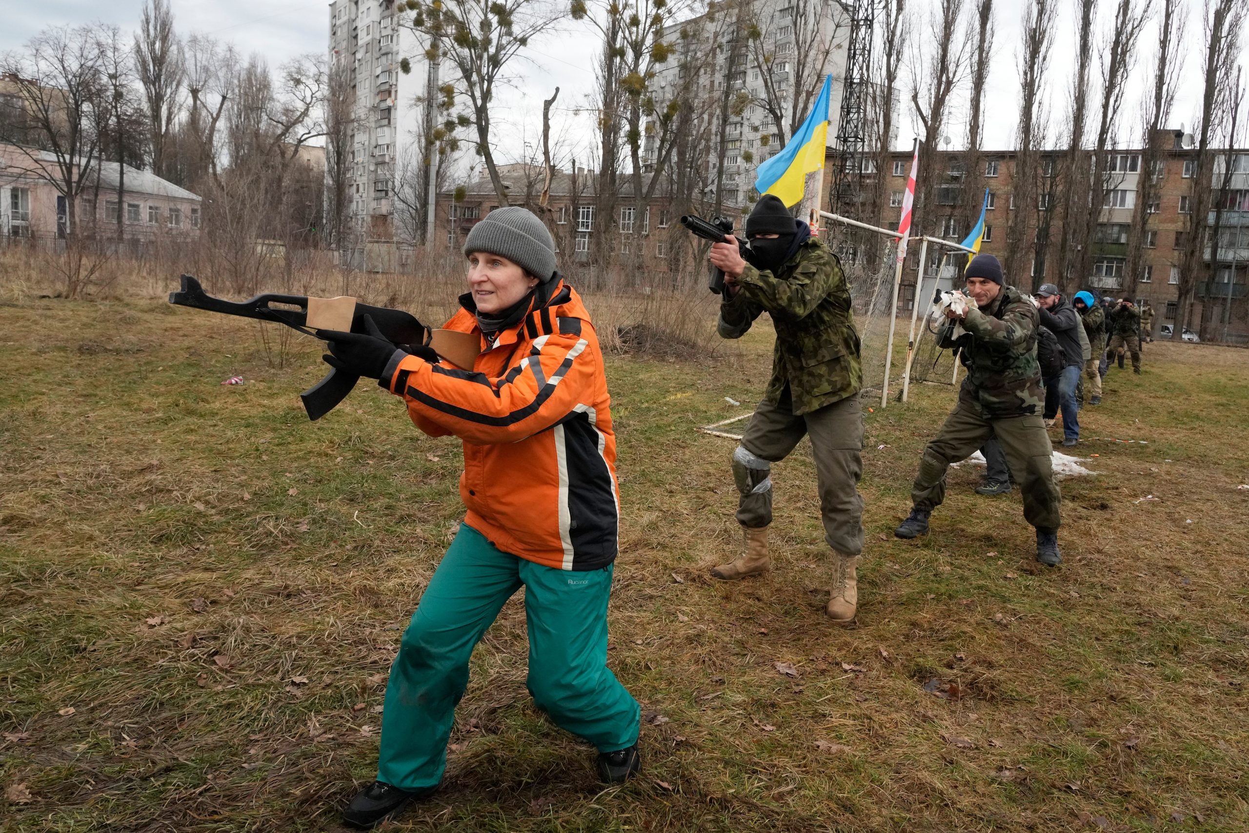 Civilians train with members of the Georgian Legion, a paramilitary unit formed mainly by ethnic Georgian volunteers to fight against Russian forces in Ukraine in 2014, in Kyiv, Ukraine, Saturday, Feb. 19, 2022.