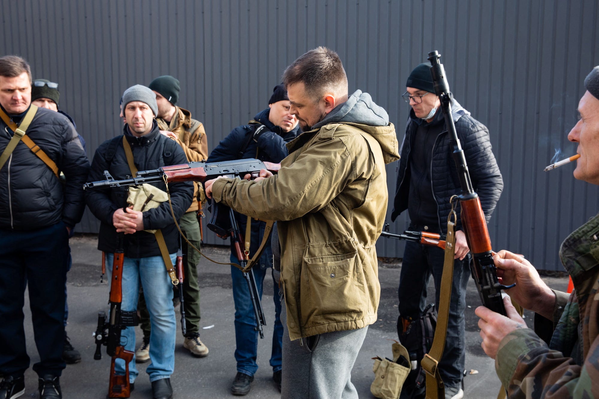 Members of the Territorial Defence Forces of Ukraine receive weapons to defend the city of Kyiv, Ukraine February 25, 2022.