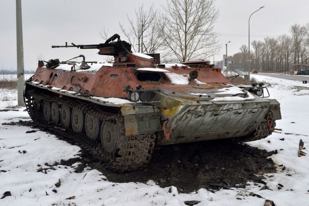 A destroyed Russian military vehicle is seen on the roadside on the outskirts of Kharkiv on February 26, 2022.