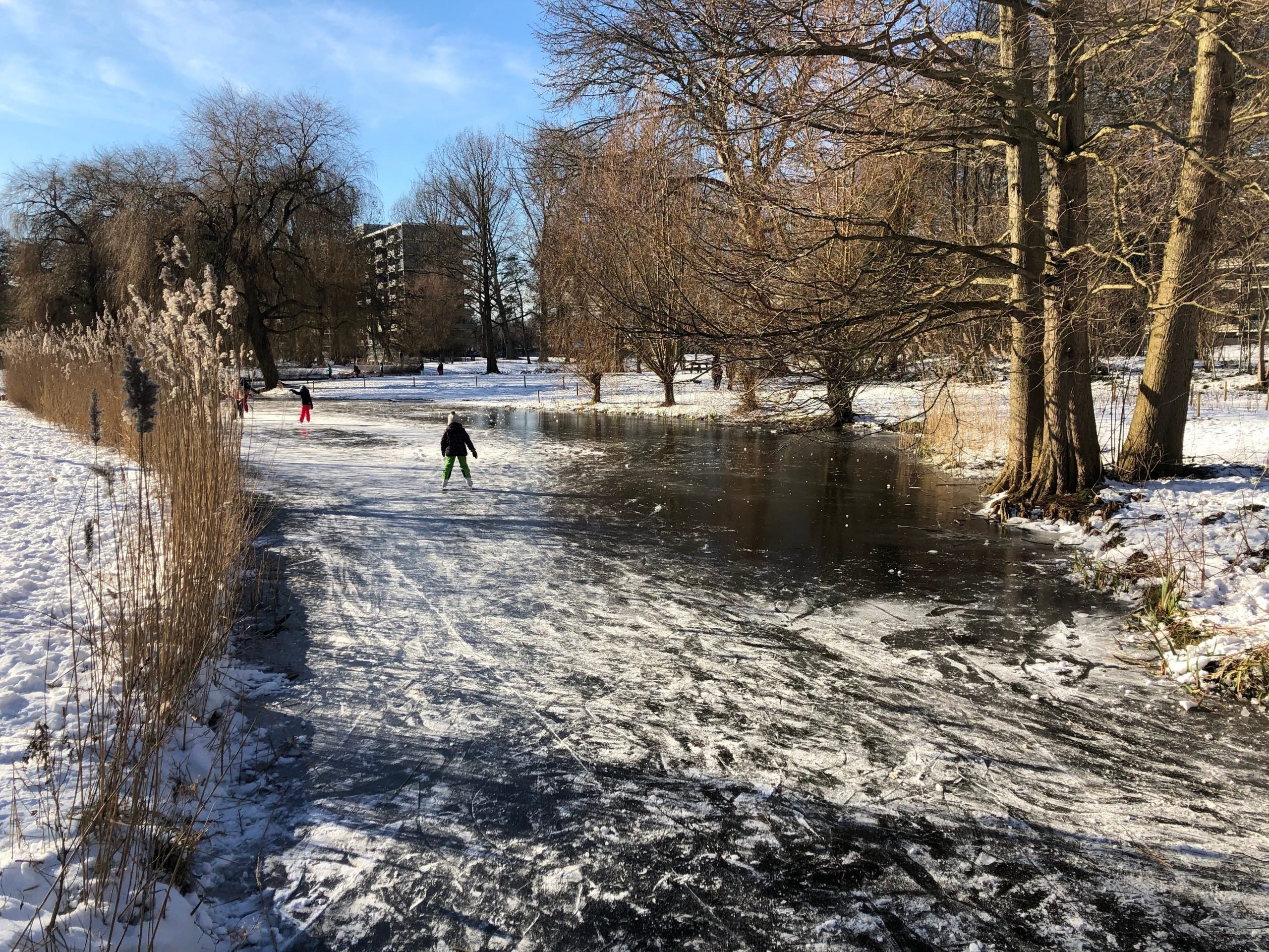 a child skating on a frozen canal in the netherlands