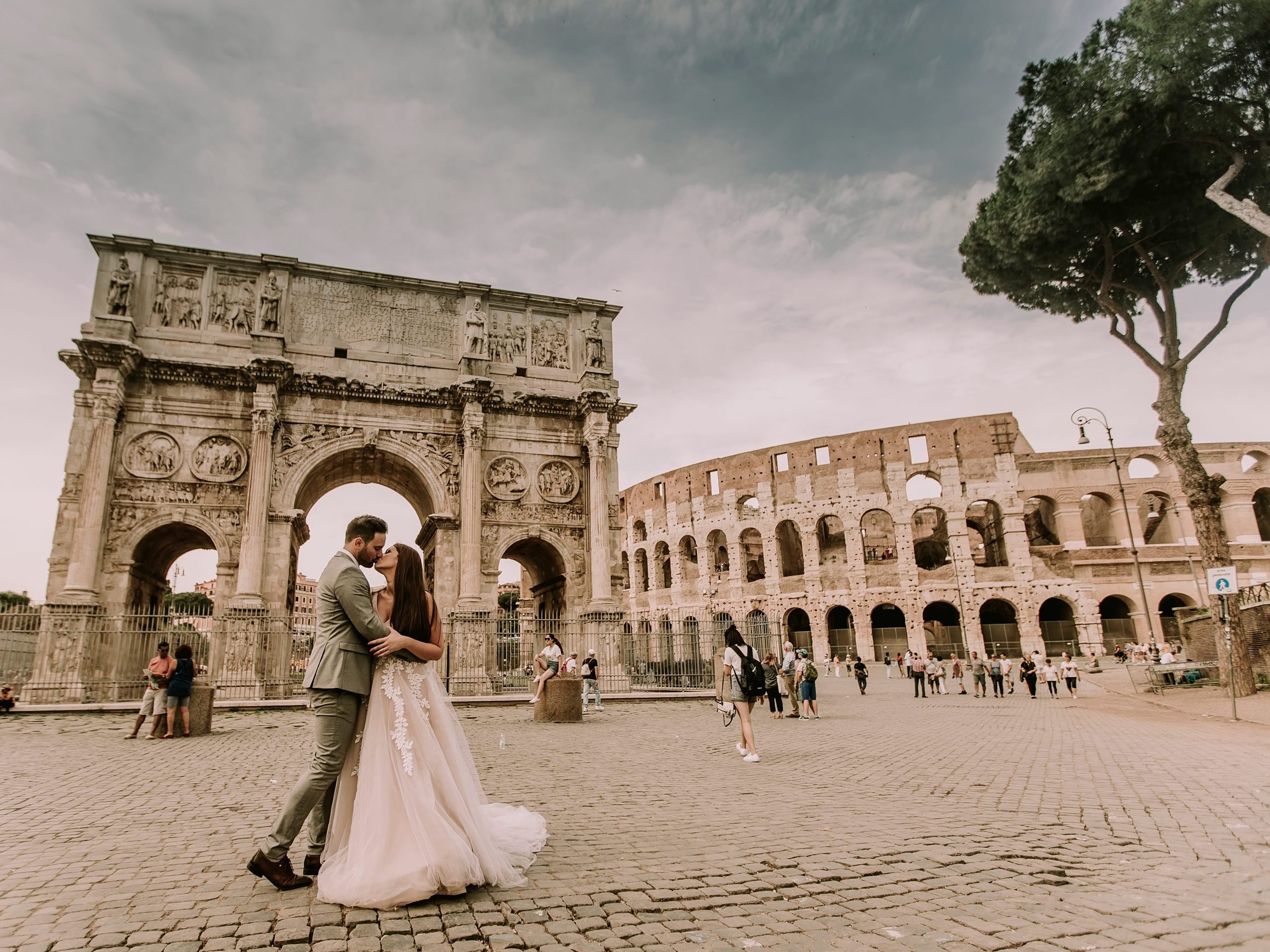 A couple marrying by Arch of Constantine in Rome, Italy