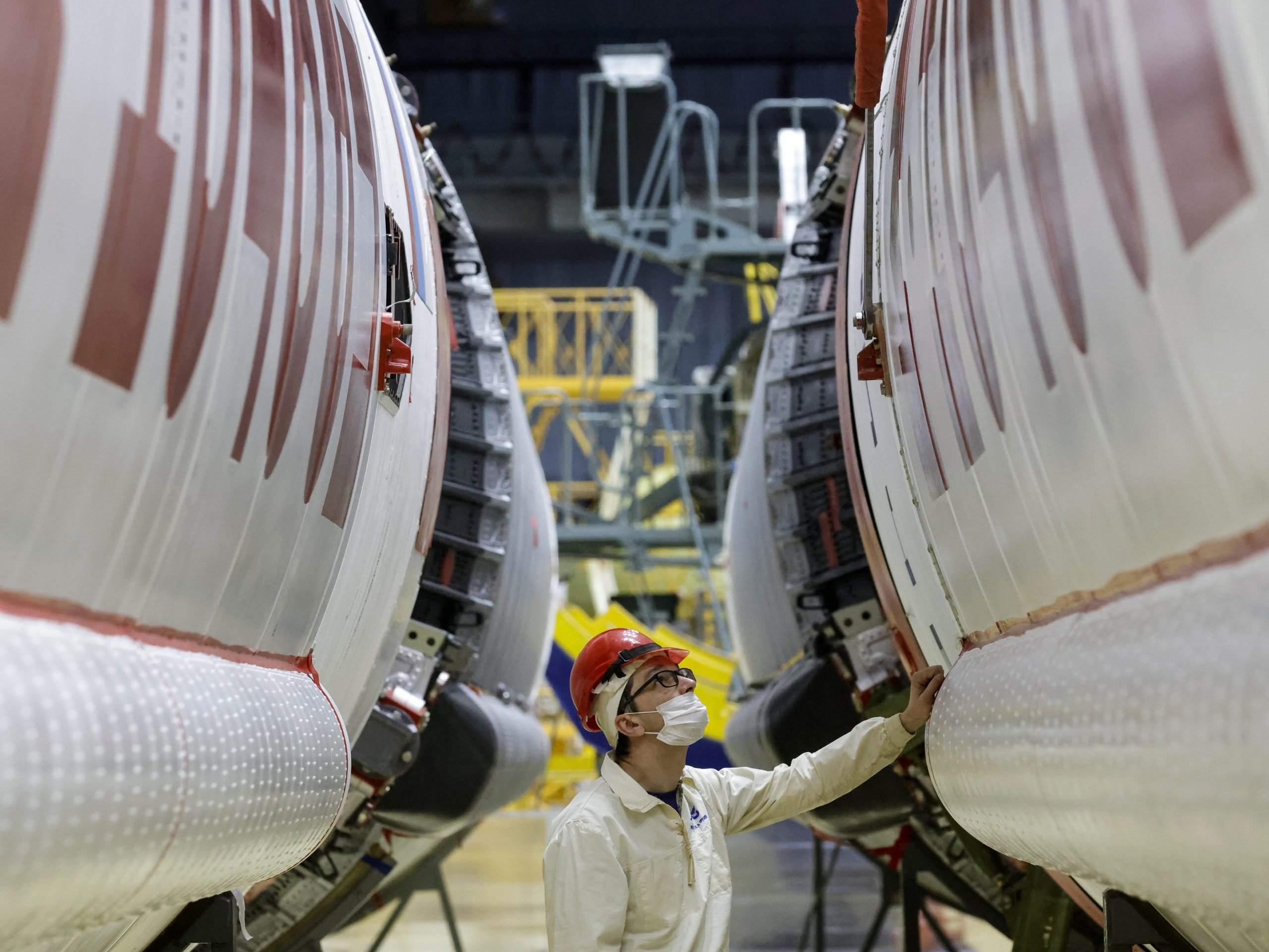 An employee prepares a Proton-M heavy-lift launch vehicle part of the ExoMars mission.