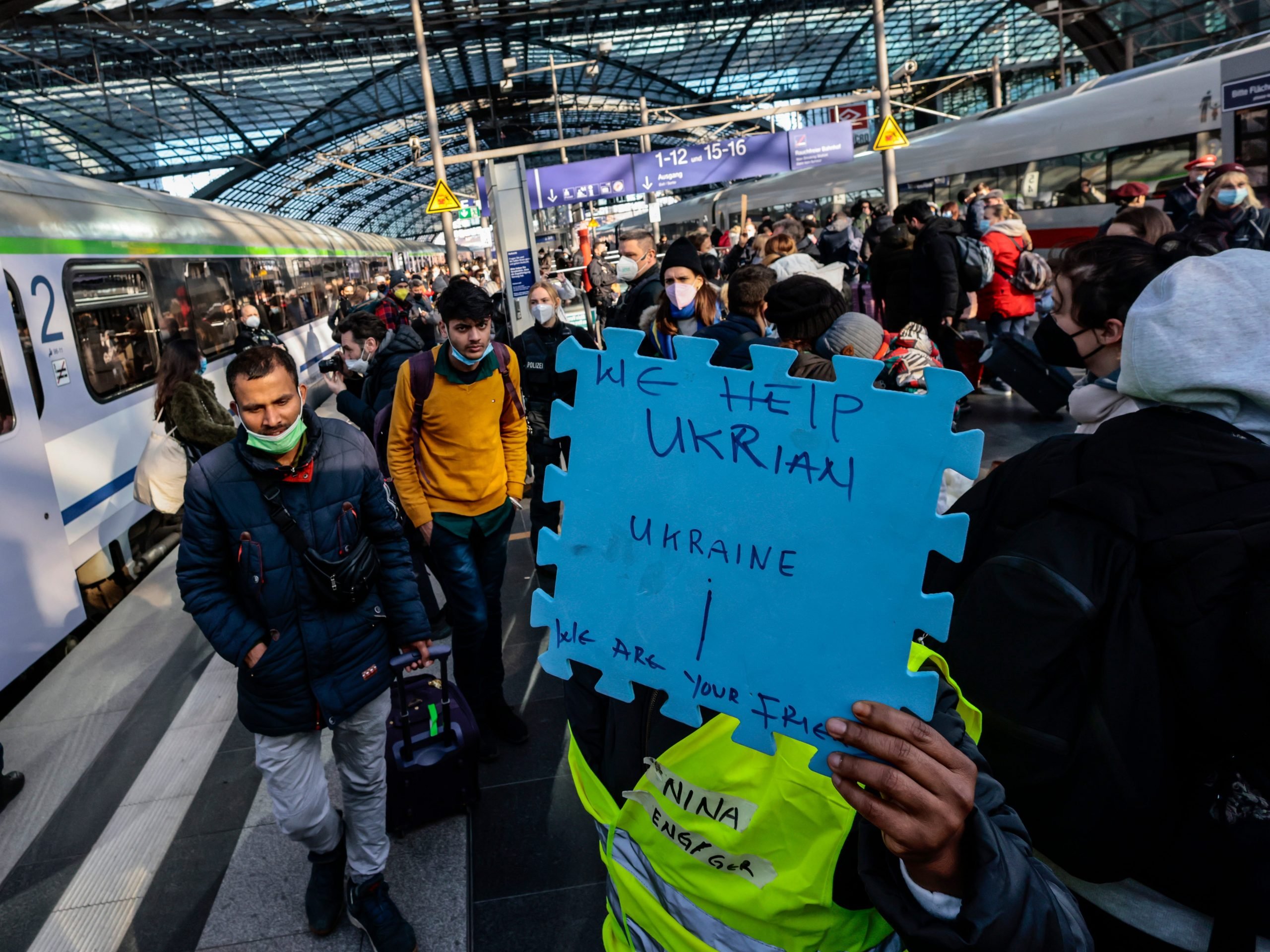 Volunteers wait for refugees from the Ukraine arriving at the main train station on March 1, 2022 in Berlin, Germany.