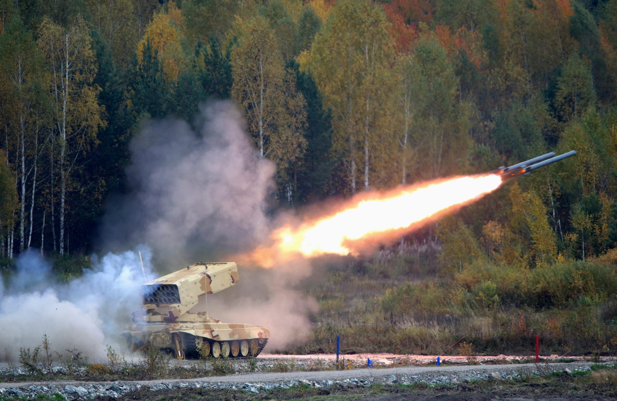A Russian "TOS-1 Buratino" multiple rocket launcher fires during the "Russia Arms Expo 2013" 9th international exhibition of arms.