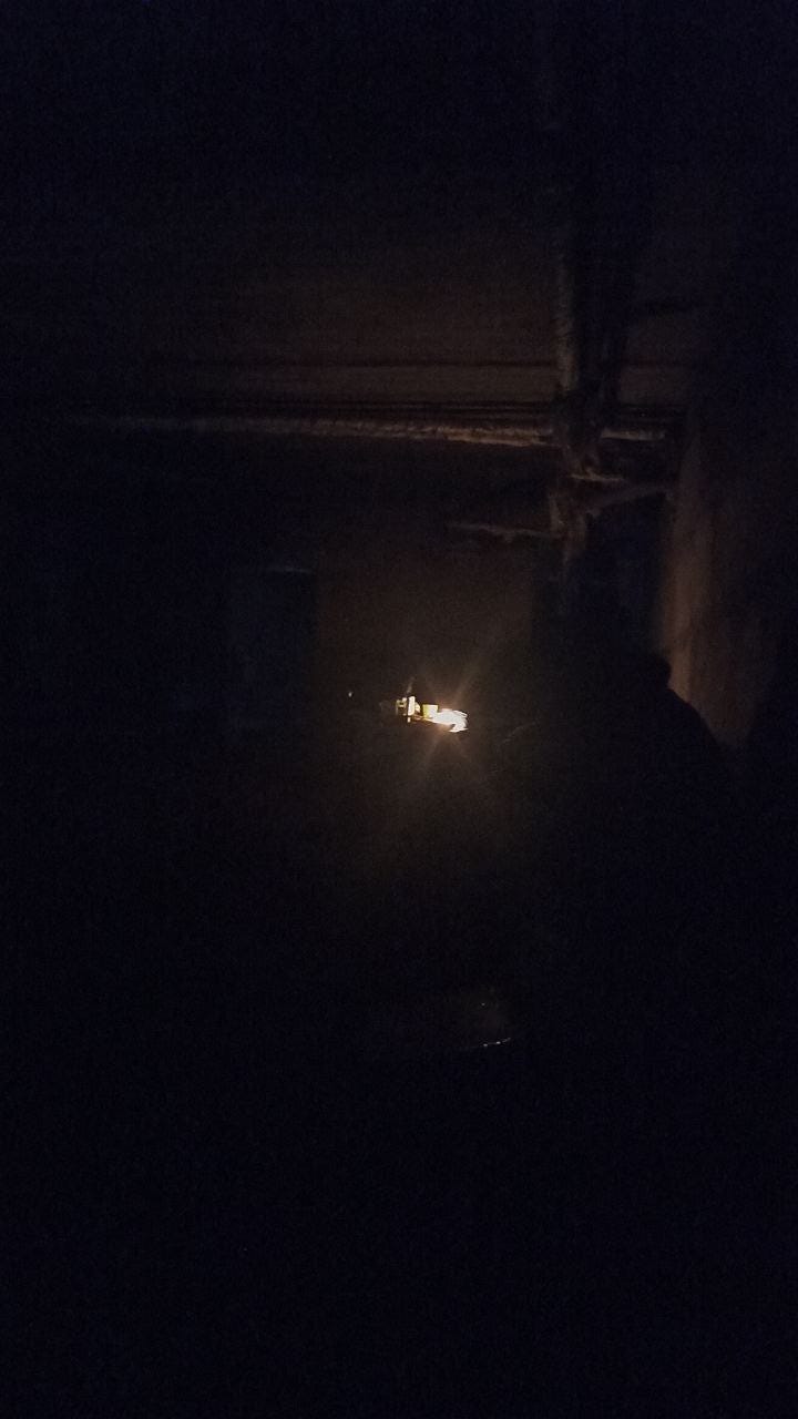 A single candle in the darkness