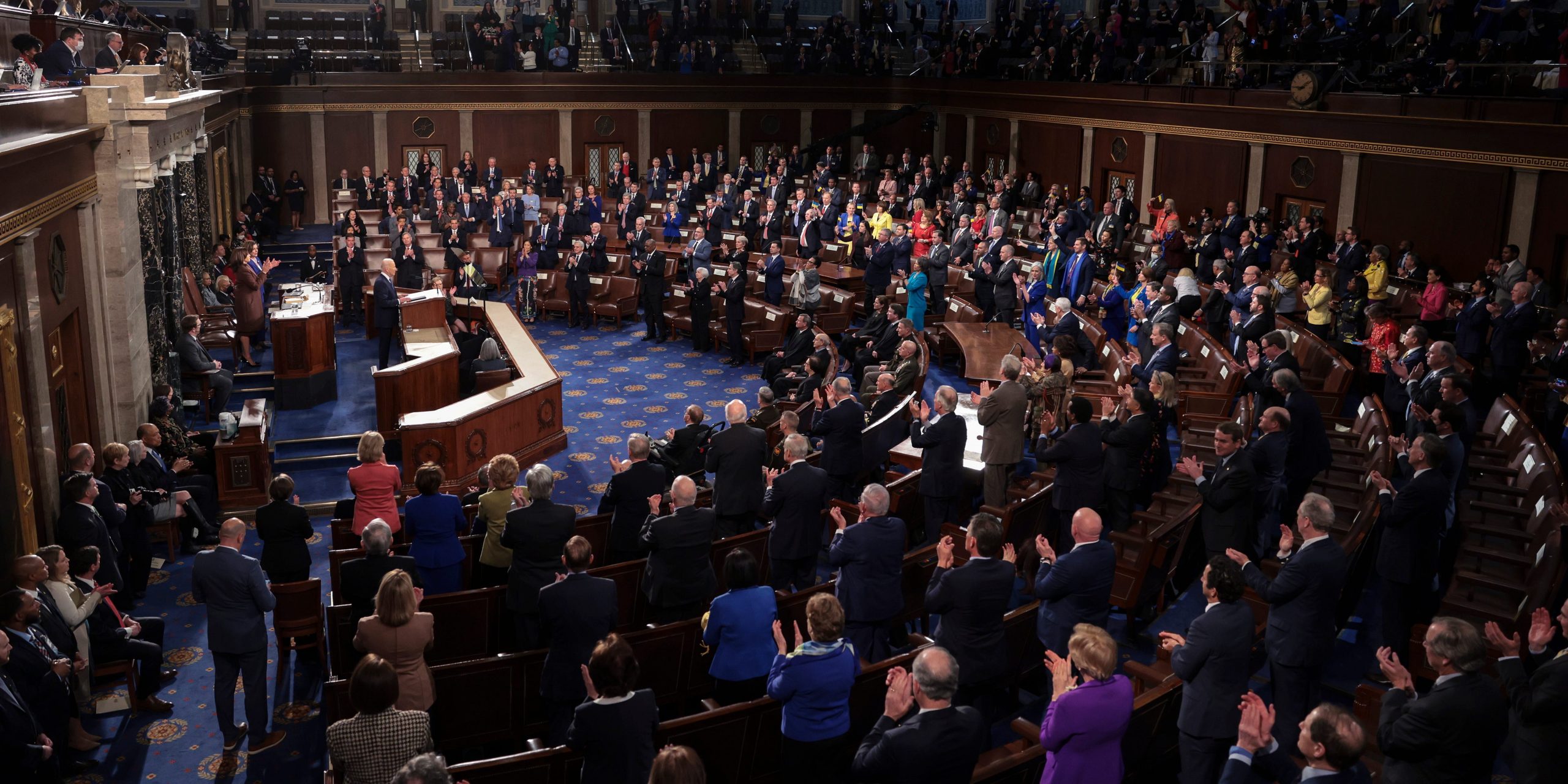 Lawmakers applaud Biden.