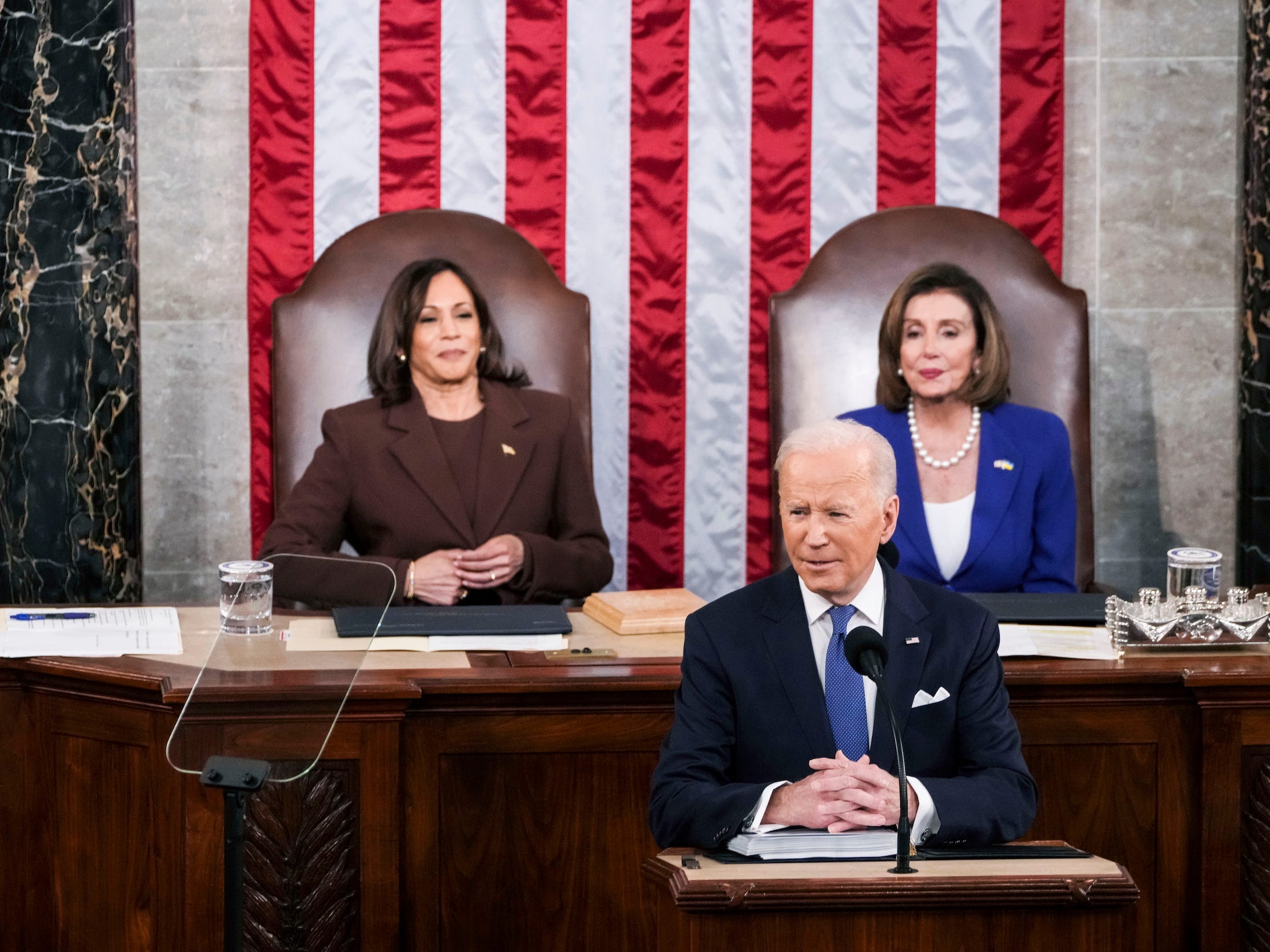 President Joe Biden delivers his first State of the Union address to a joint session of Congress at the Capitol, Tuesday, March 1, 2022, in Washington, as Vice President Kamala Harris and Speaker of the House Nancy Pelosi of California, look on.