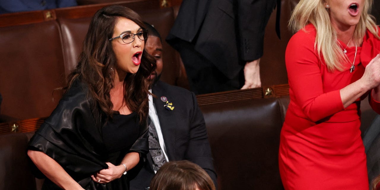 U.S. Rep. Lauren Boebert (R-CO) and Rep. Marjorie Taylor Greene (R-GA) scream "Build the Wall" at President Joe Biden during Biden's State of the Union address to a joint session of the U.S. Congress in the House of Representatives Chamber at the Capitol in Washington, U.S. March 1, 2022.
