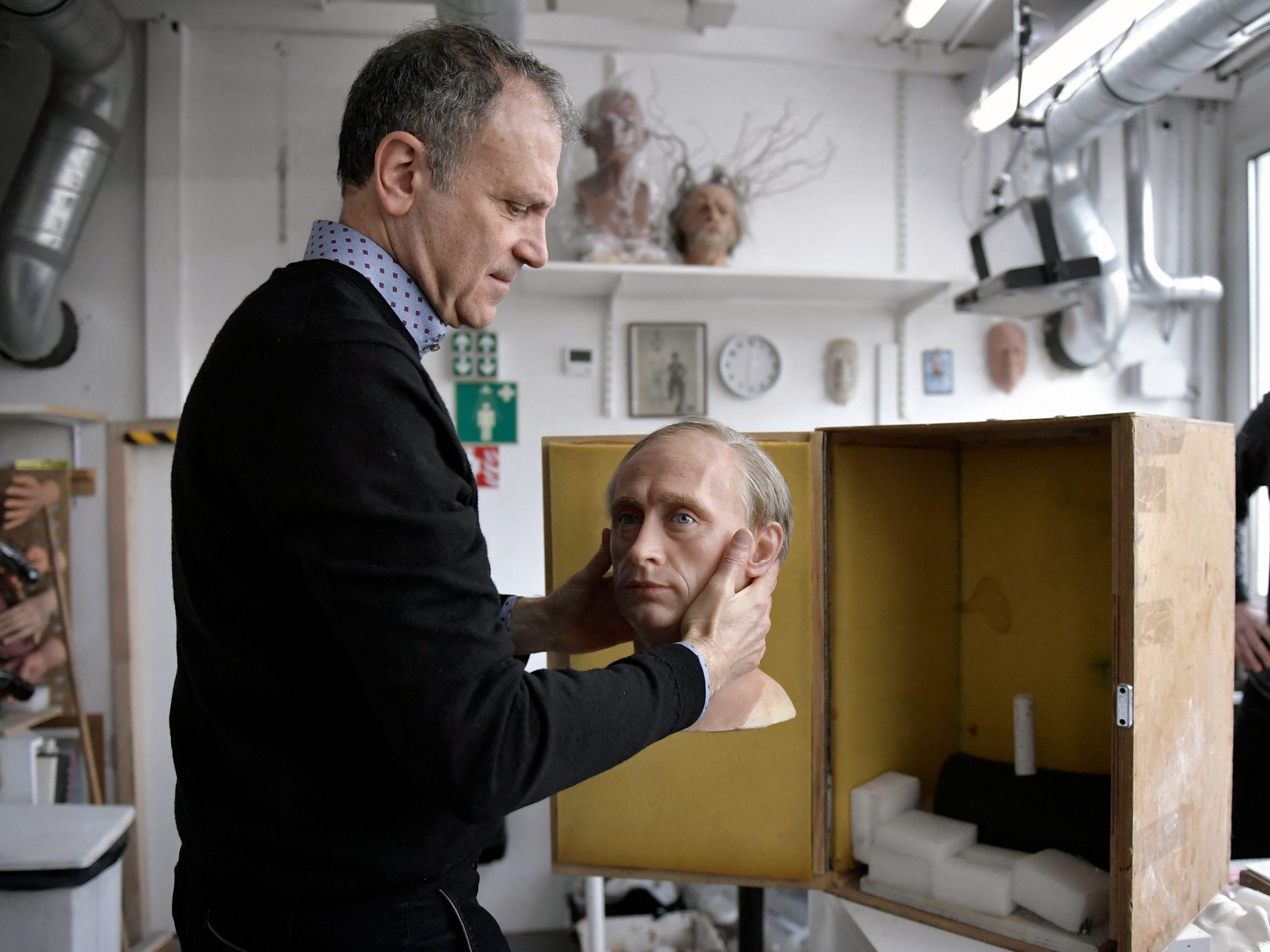 ves Delhommeau, Musee Grevin's French Director General, packs a wax statue of Russian President Vladimir Putin before it is stored in the reseve, as a reaction to Russia's invasion of Ukraine on March 1, 2022 at the Grevin museum in Paris.