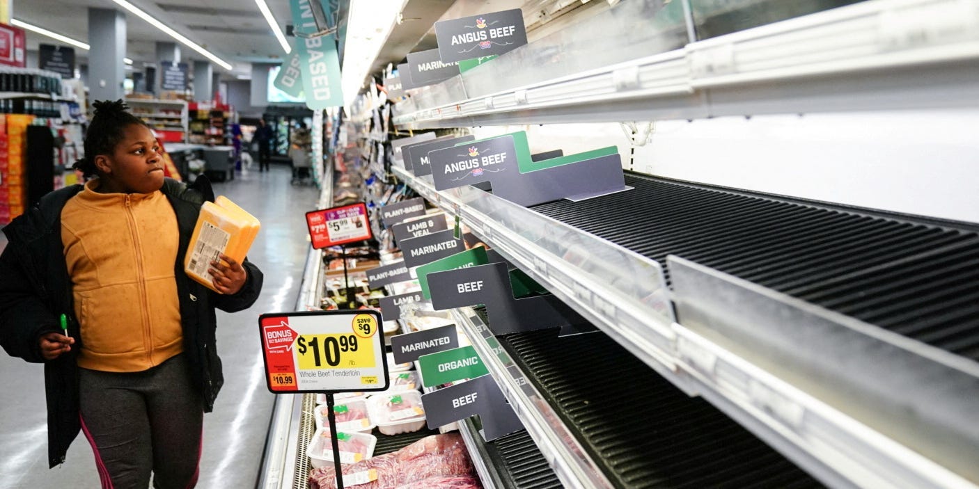 A shopper walks by a beef display case at a Giant Food grocery store in Washington January 9, 2022.