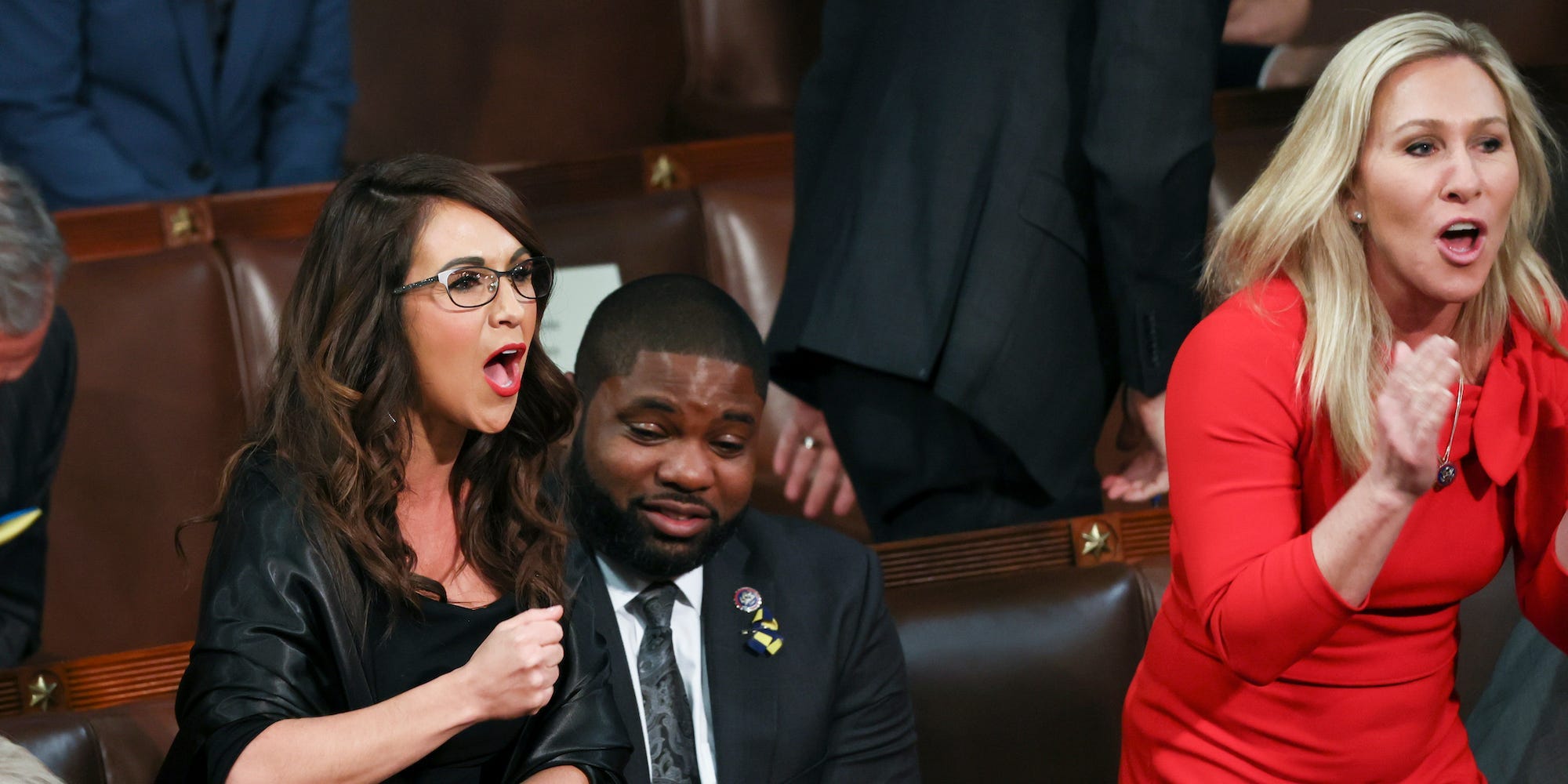 Rep. Lauren Boebert, R-Colo., left, and Rep. Marjorie Taylor Greene, R-Ga., right, scream "Build the Wall" as President Joe Biden delivers his first State of the Union address to a joint session of Congress at the Capitol, Tuesday, March 1, 2022, in Washington