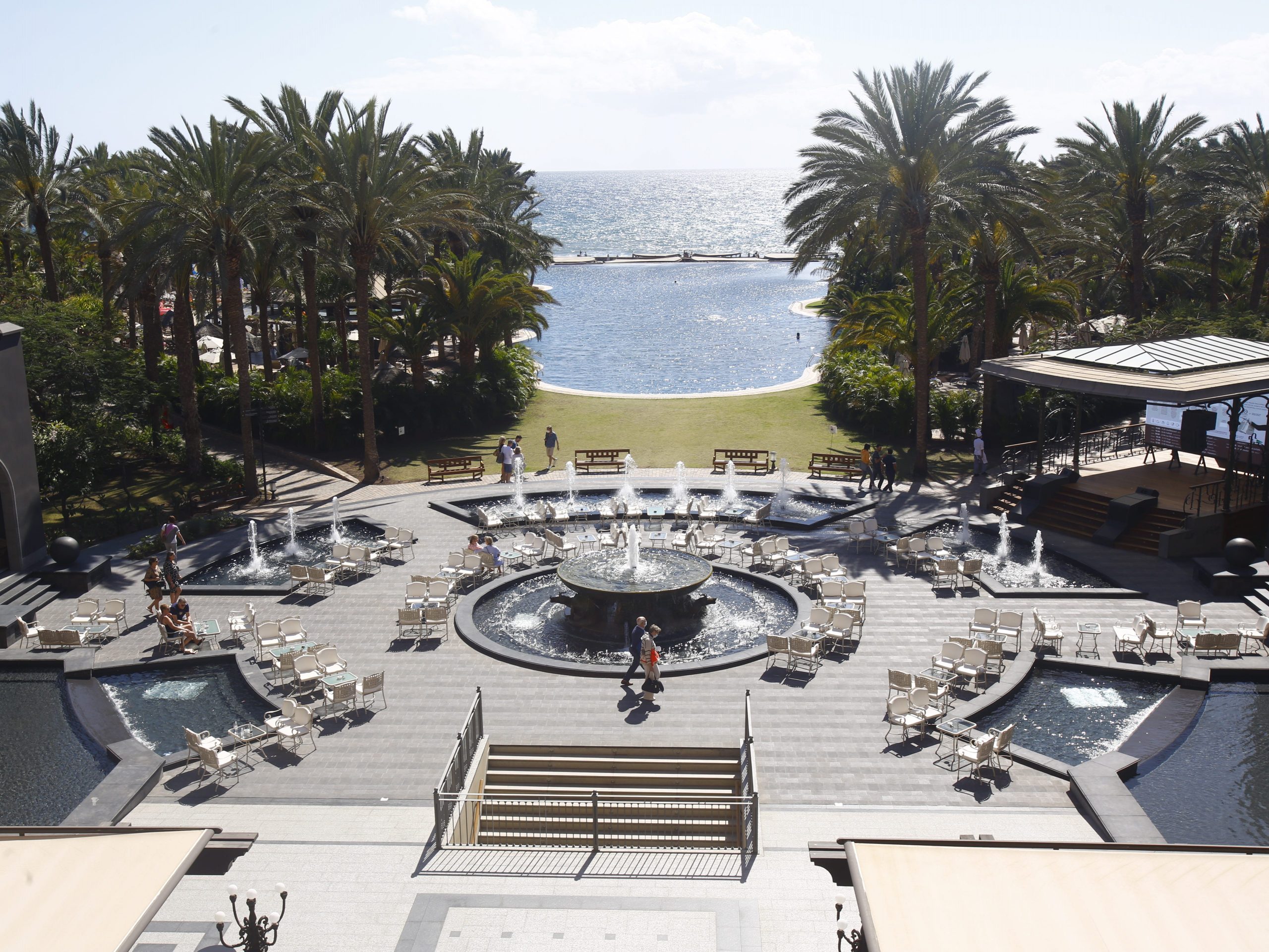 A view overlooking the pool, fountains, and beach at Lopesan Costa Meloneras Hotel on Gran Canaria, Canary Islands.