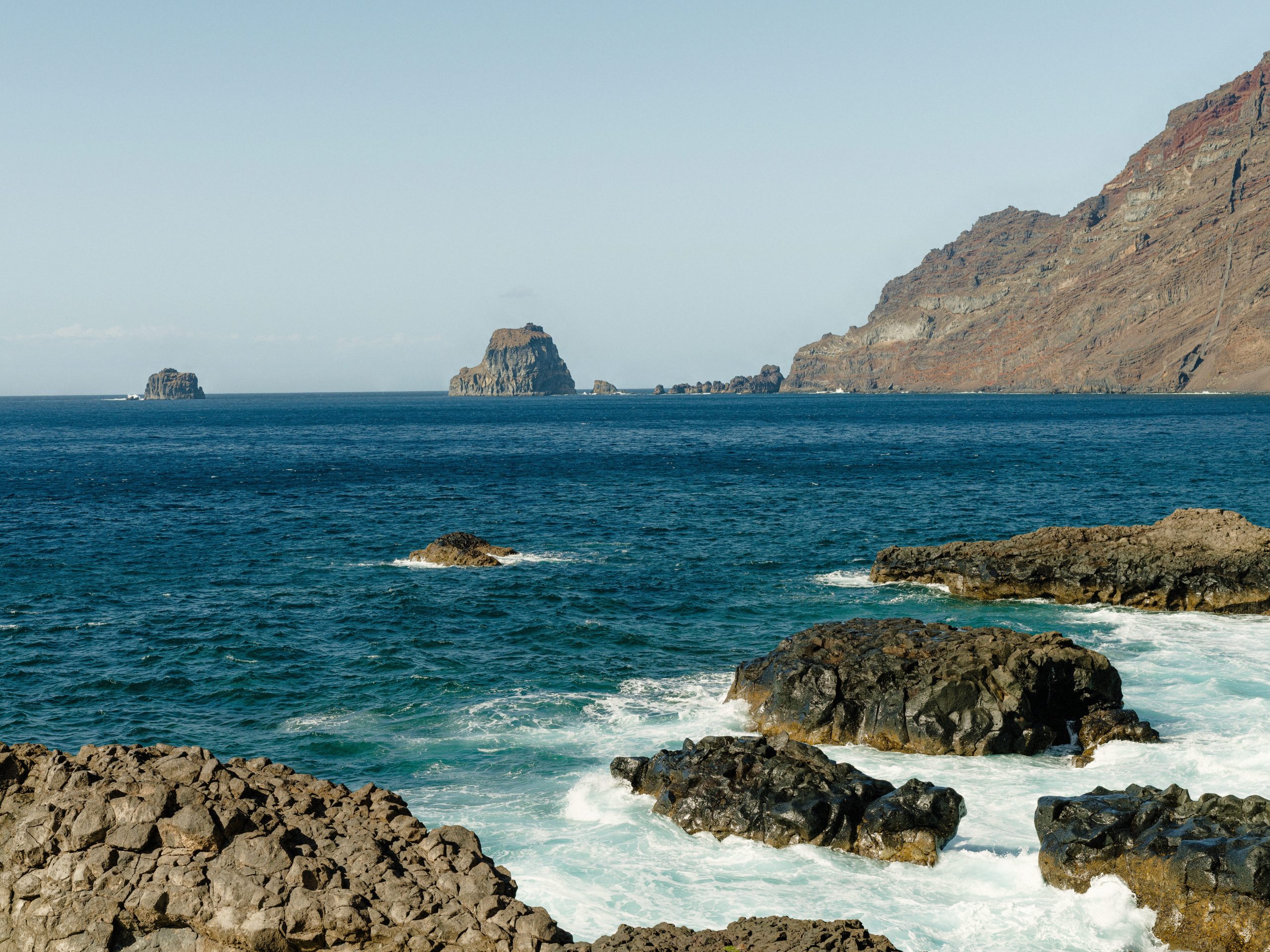 The water breaking along the rocks on a beach on El Hierro, Canary Islands.