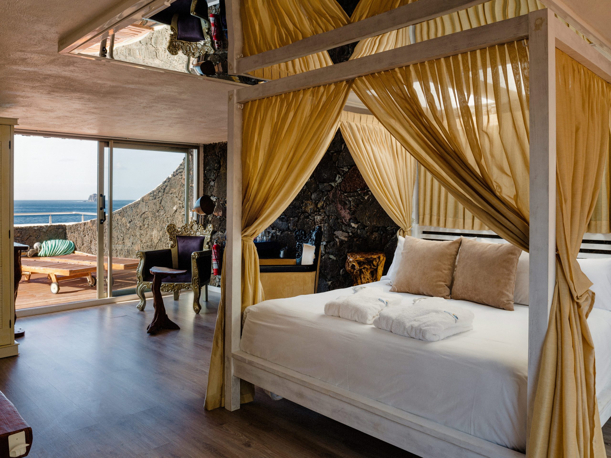 A canopy bed with sea views at Hotel Puntagrande on El Hierro, Canary Islands