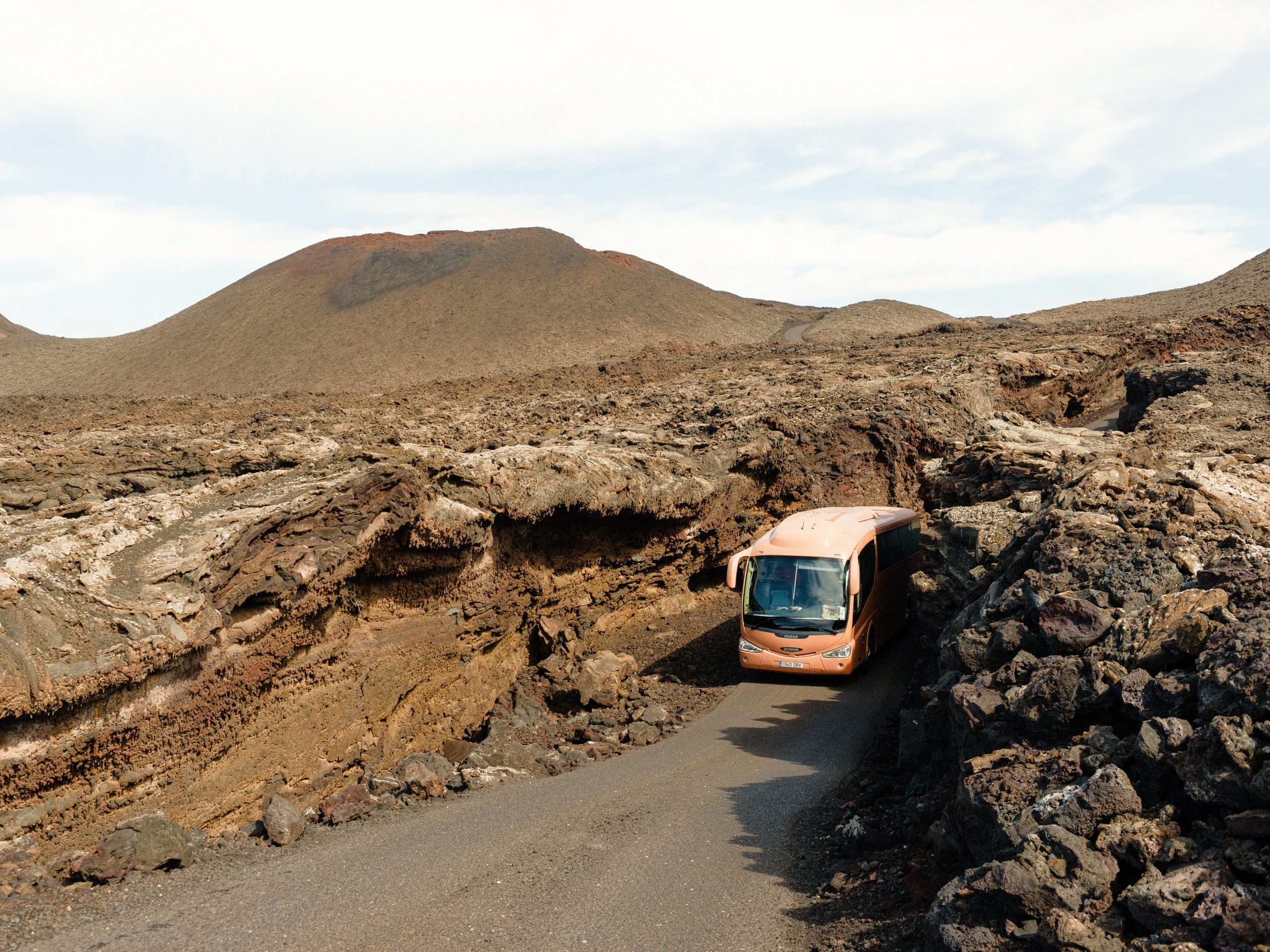 A bus driving through the mountains in Canary Islands