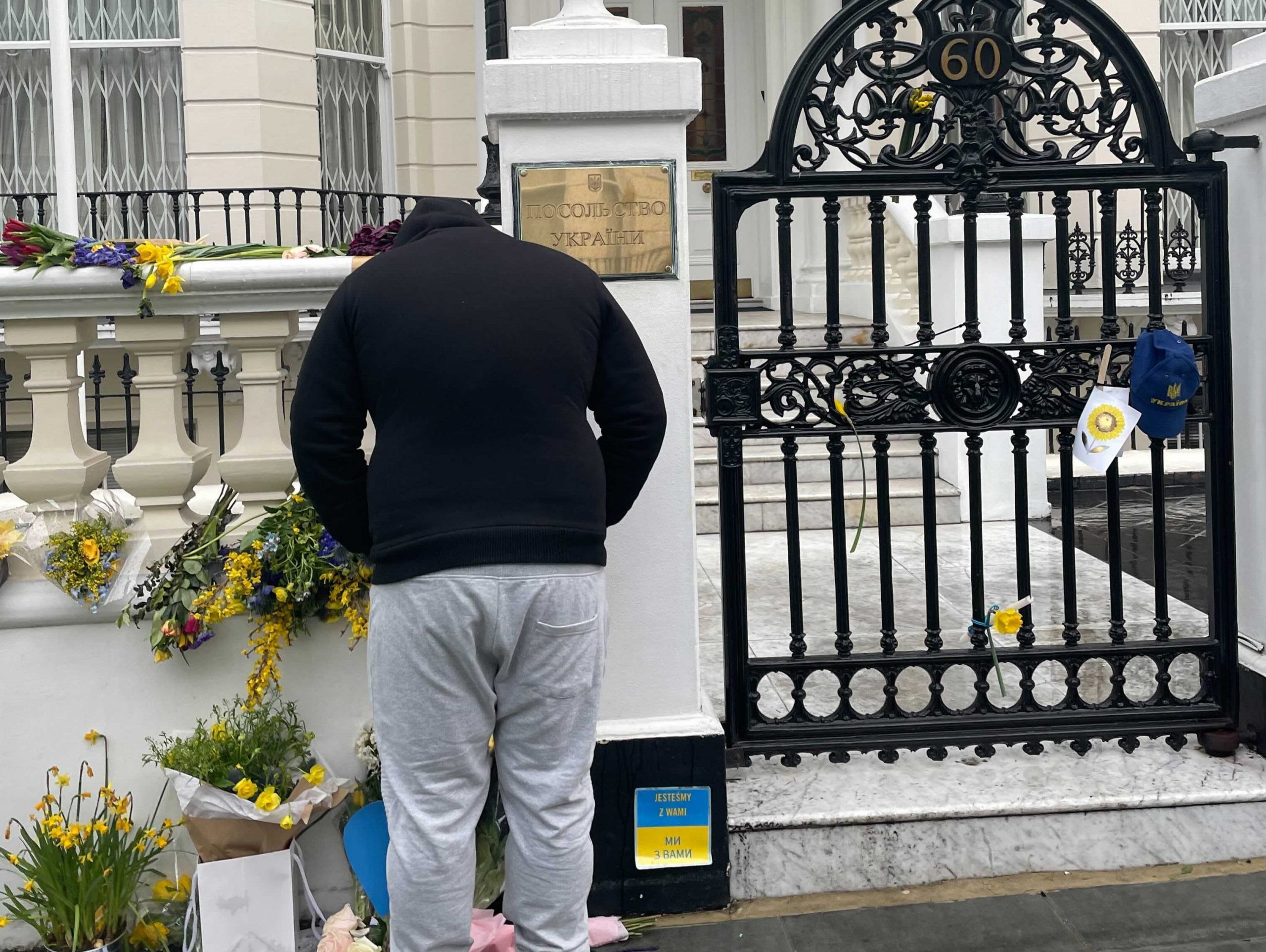 A man rings the doorbell for the Embassy of Ukraine in London.