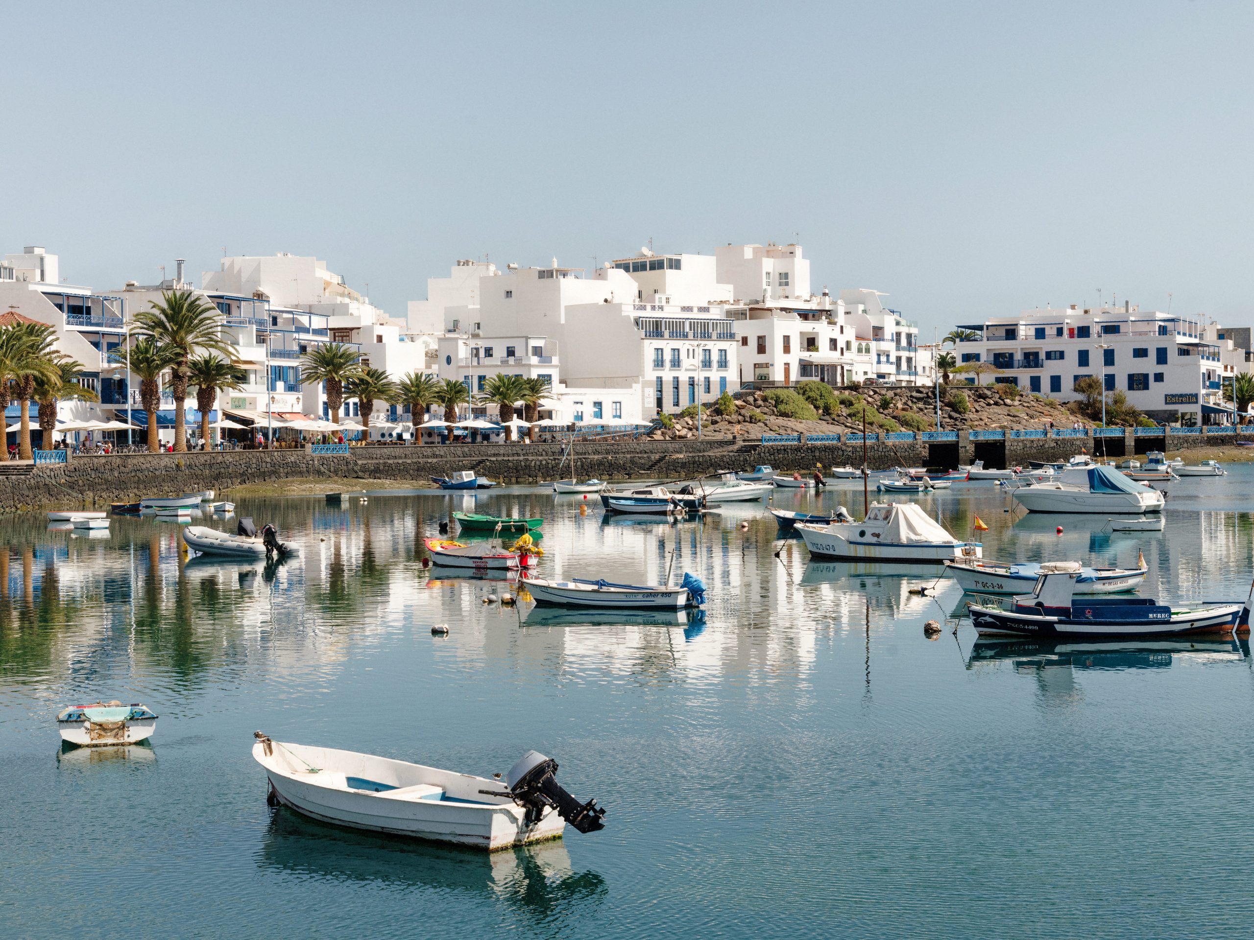 Boats in a marina facing buildings on the shore on Lanzarote, Canary Islands