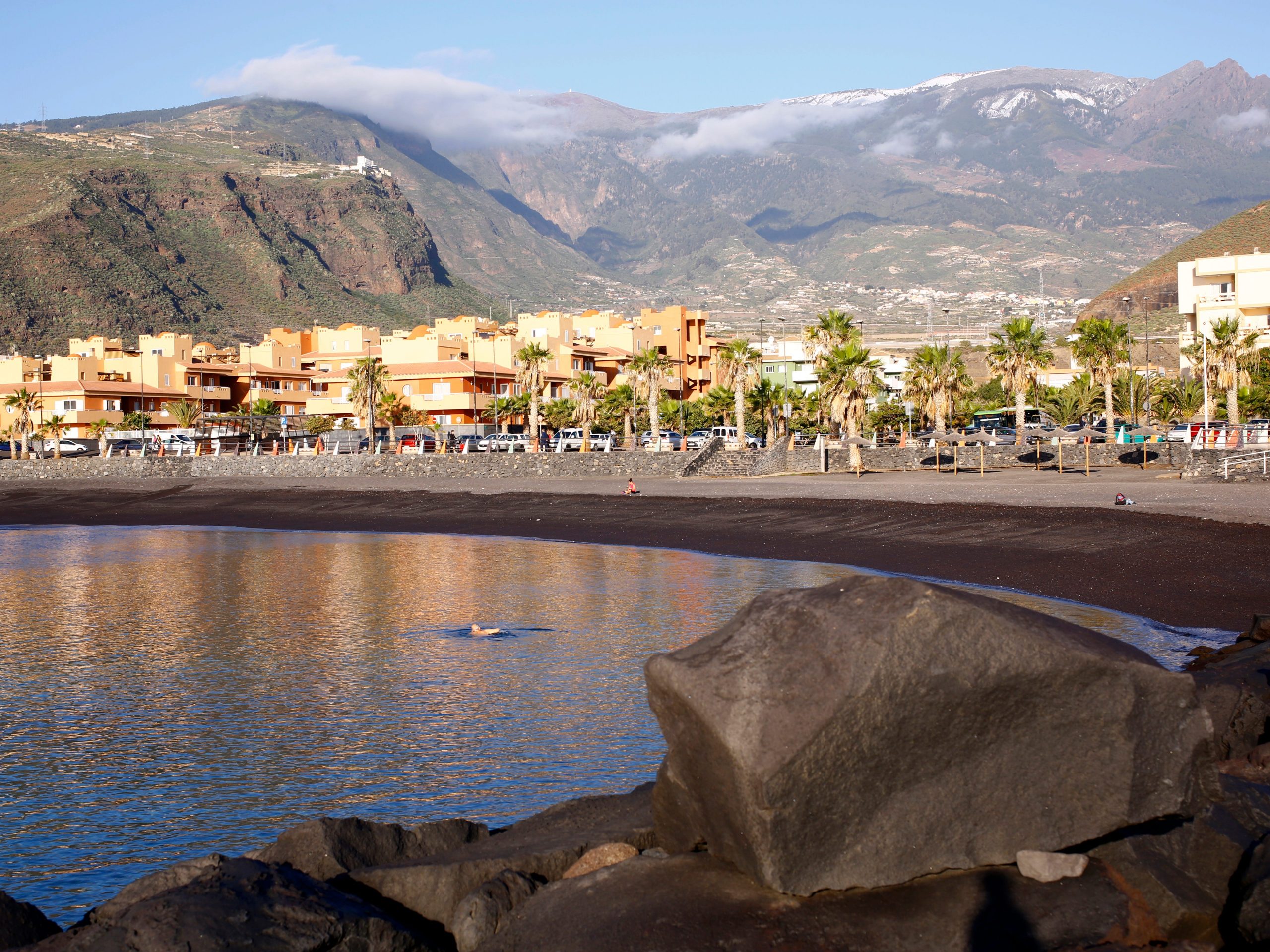 The beach and waterfront area with mountains in the back in Tenerife, Canary Islands