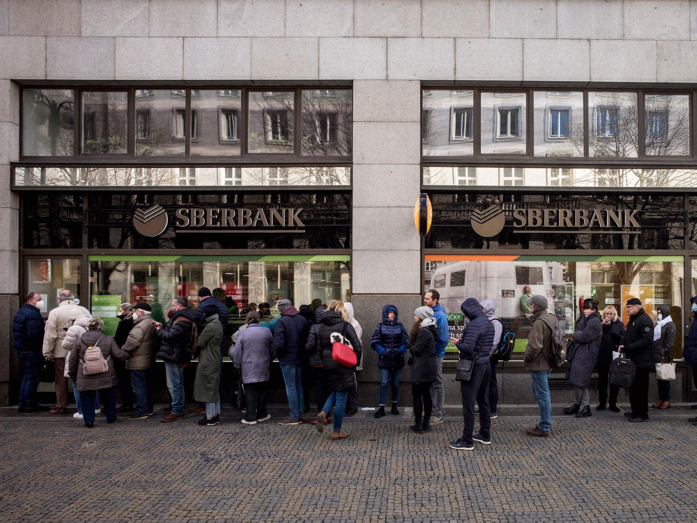 People stand in line for ATM outside Russia's Sberbank