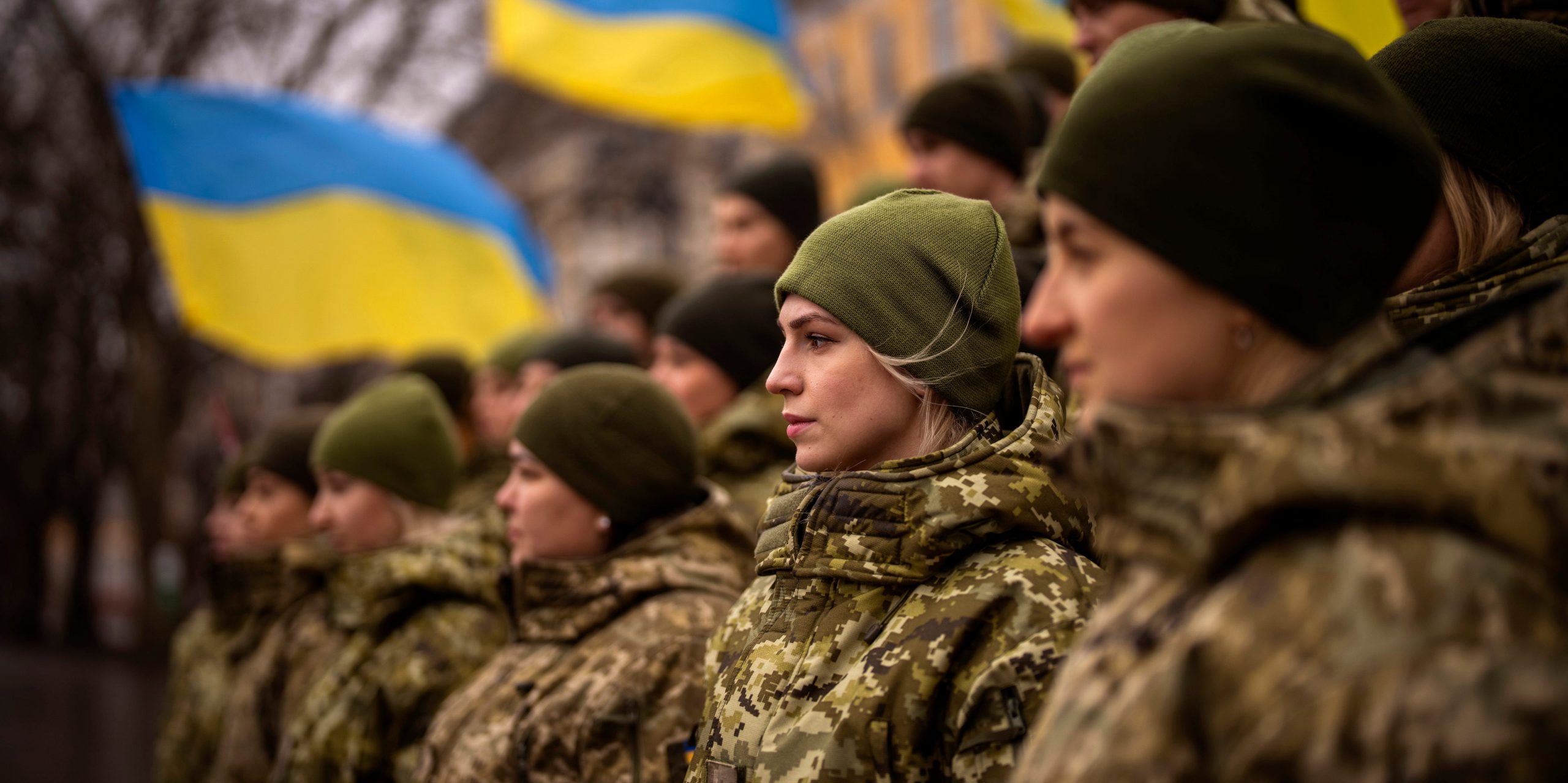 Ukrainian Army soldiers pose for a photo as they gather to celebrate a Day of Unity in Odessa, Ukraine, Wednesday, Feb. 16, 2022.