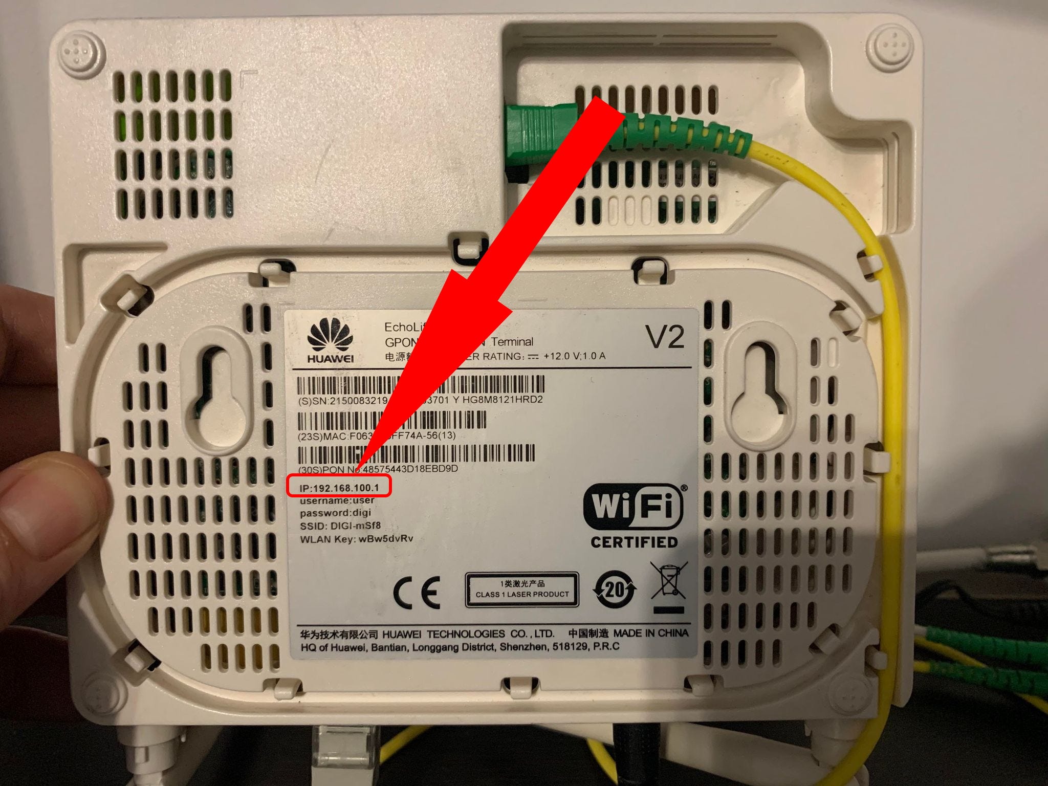 A router, with the IP address written on the back and highlighted.