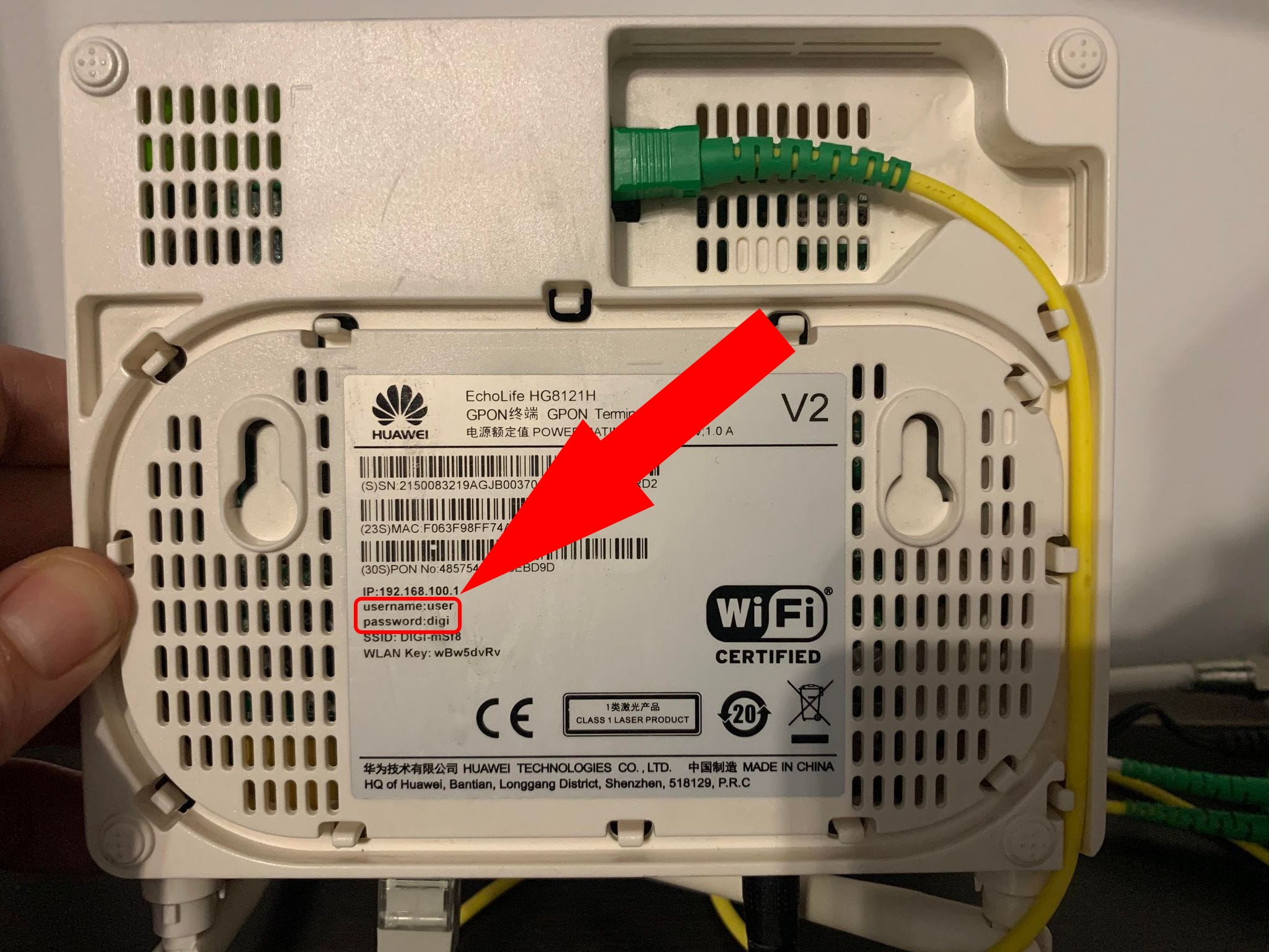 The bottom of the router, with the username and password highlighted.