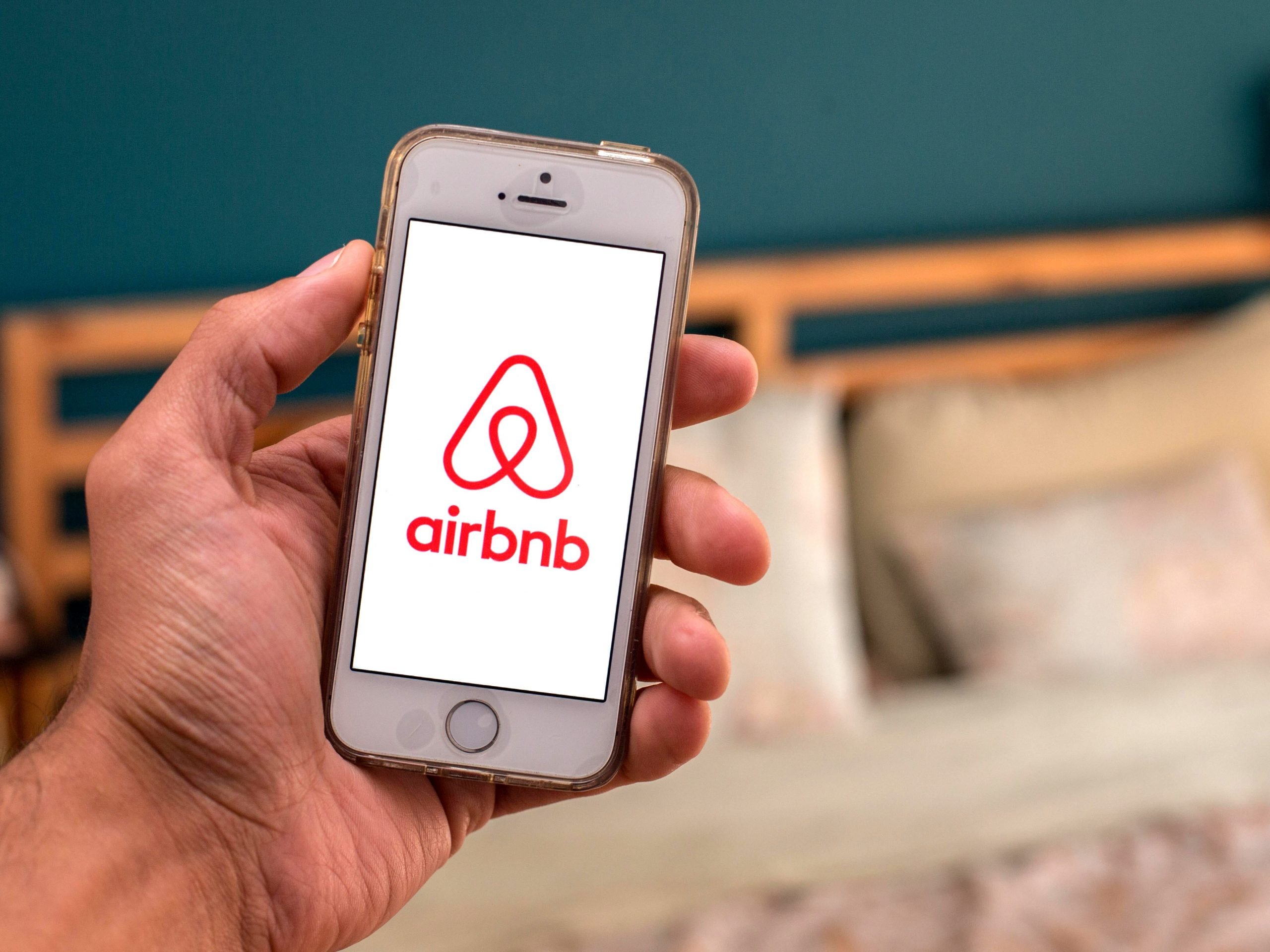 In this photo illustration, the Airbnb app seen displayed on a smartphone screen.