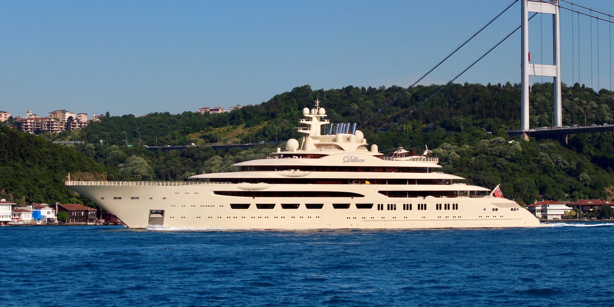 A yacht, the Dilbar, owned by Alisher Usmanov, is seen against a blue sea and sky in the Bosphorus in 2019.