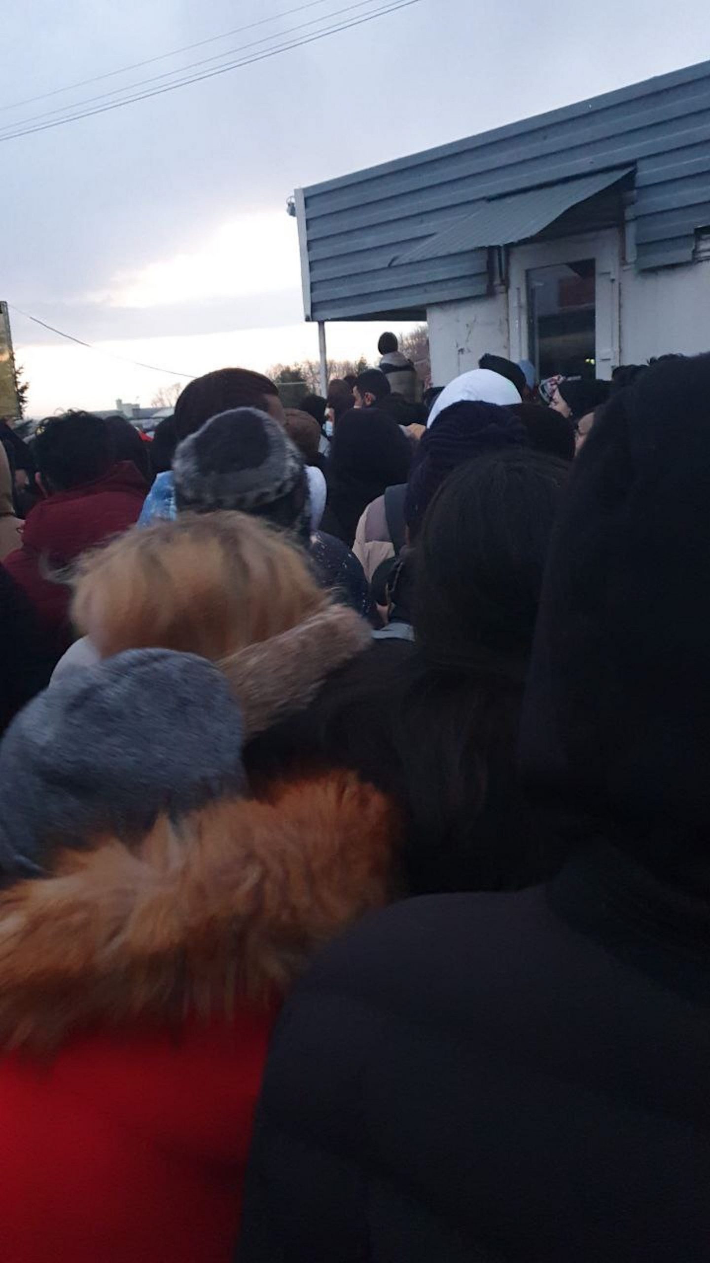 A  crowd of people at Ukraine's border with Poland.