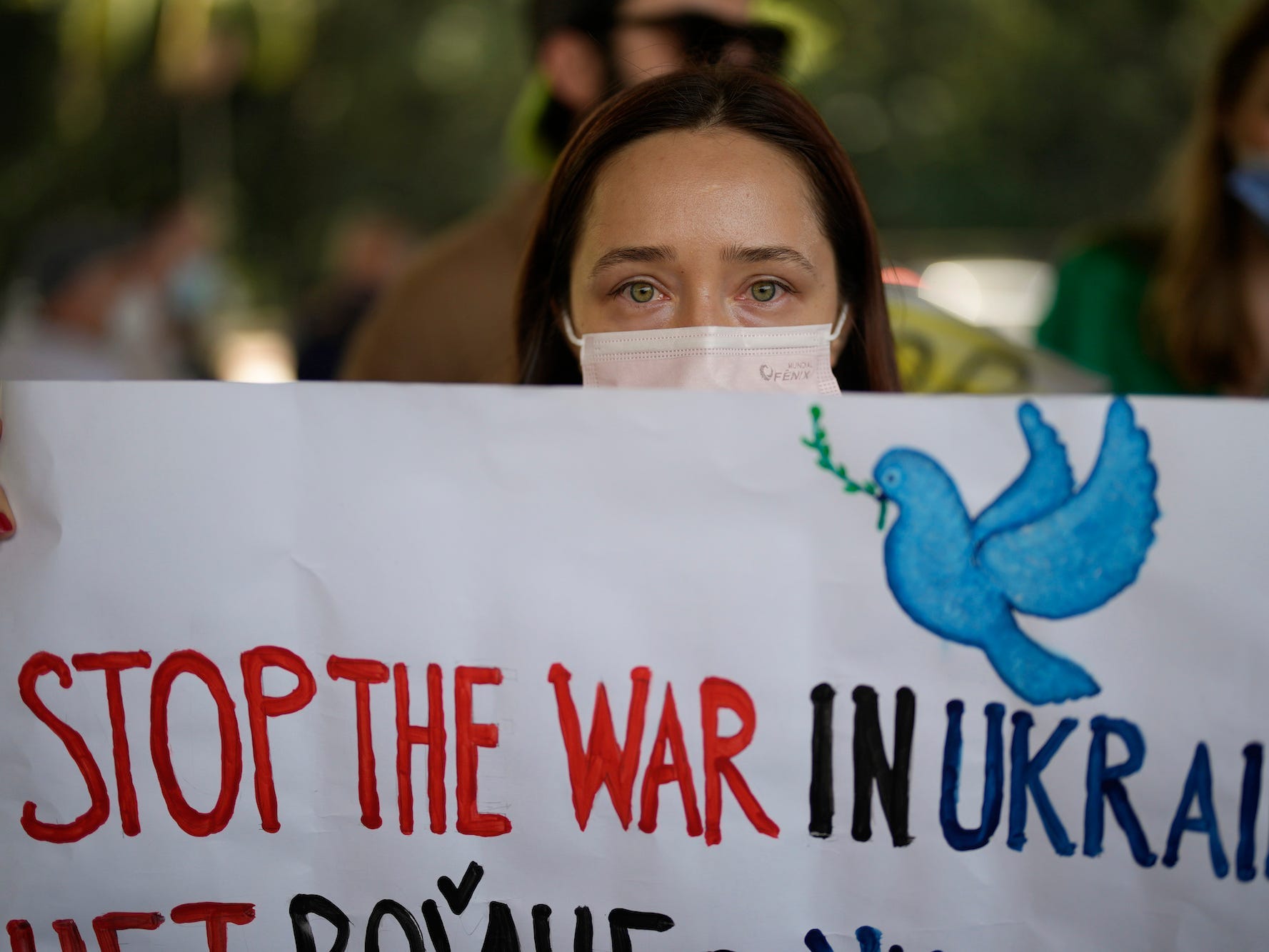 A Ukrainian living in Brazil attends a protest against Russia's invasion of Ukraine in Sao Paulo, Brazil, Friday, Feb. 25, 2022.