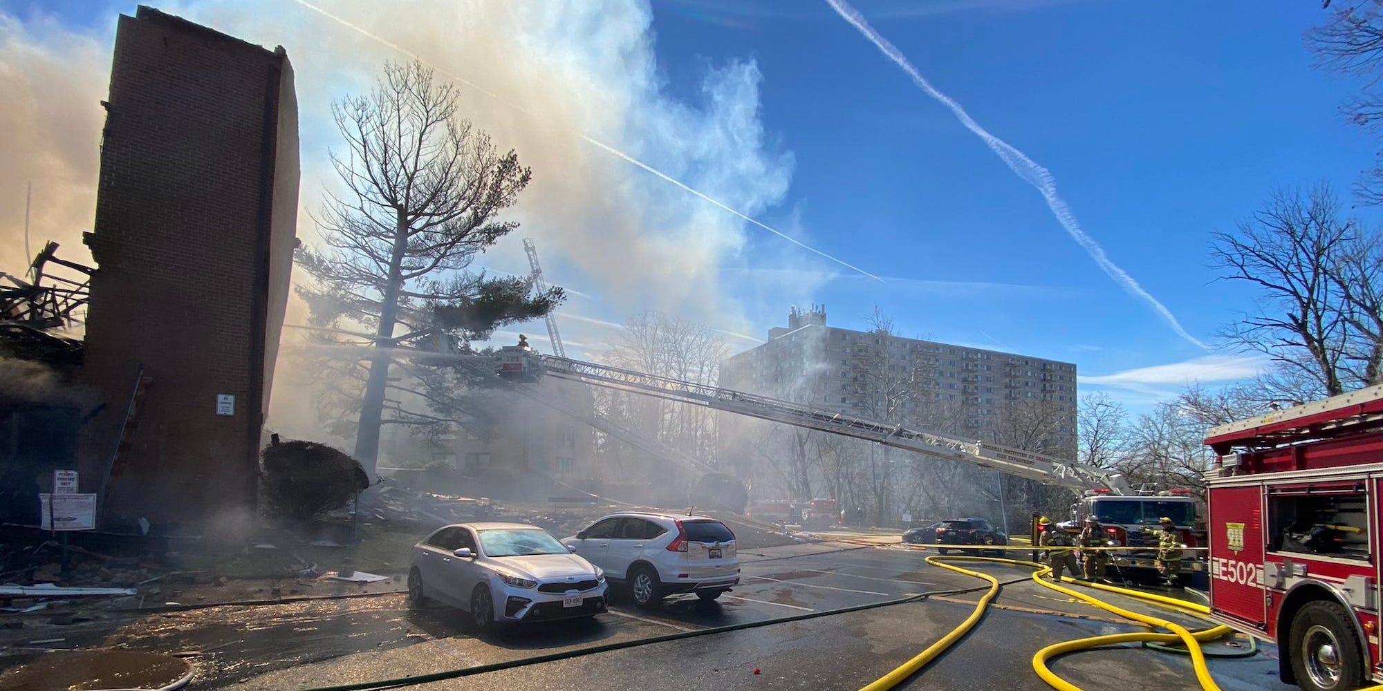 A plume of smoke rises from a collapsed and burning apartment block in Silver Spring, Montgomery County, Maryland.